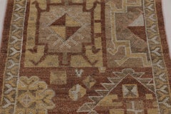 Rug & Kilim’s Turkish-Inspired Rug in Terracotta & Gold with Tribal Motifs