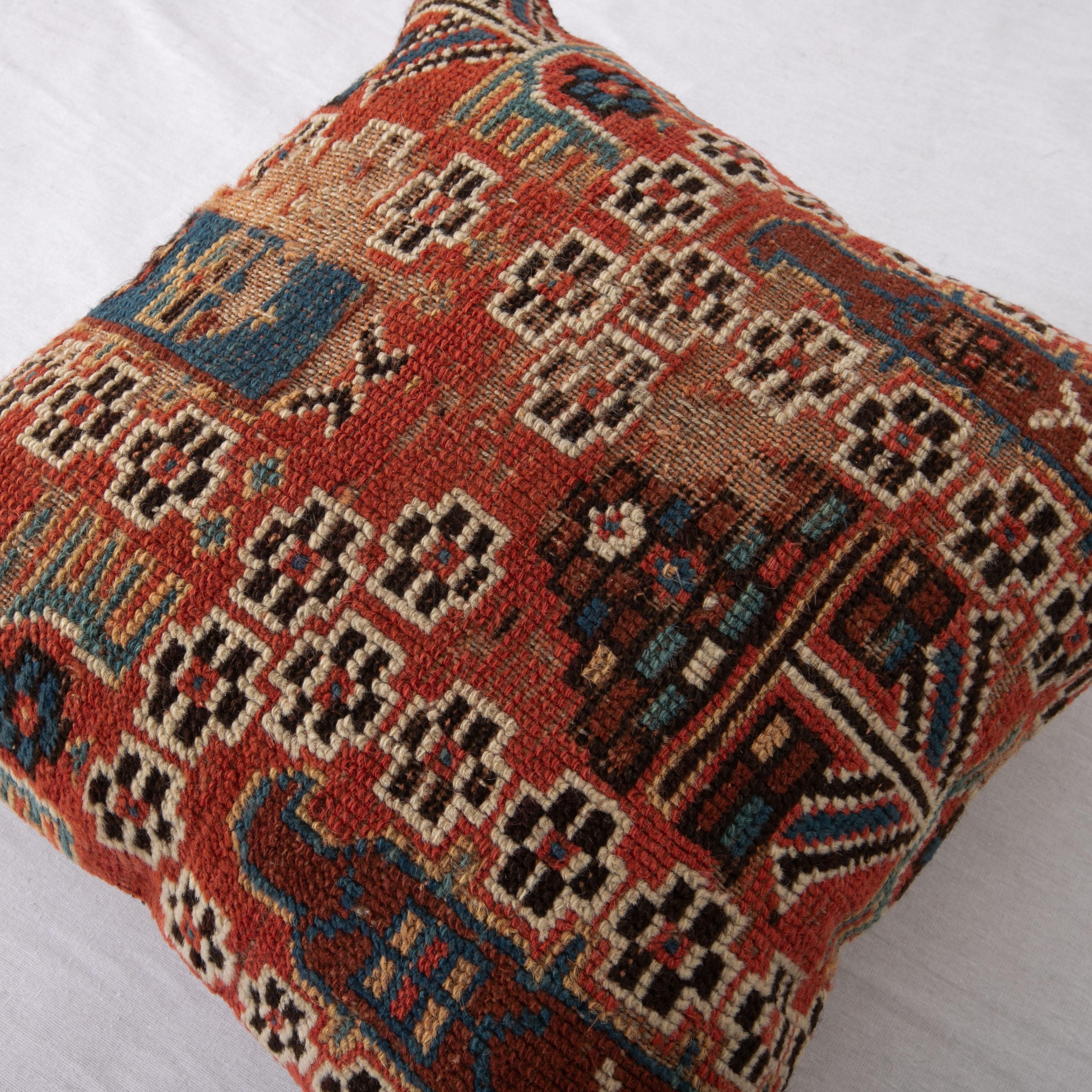 Rug Pillow Cover Made from a Caucasian Shirvan Rug, Early 20th C. In Distressed Condition For Sale In Istanbul, TR