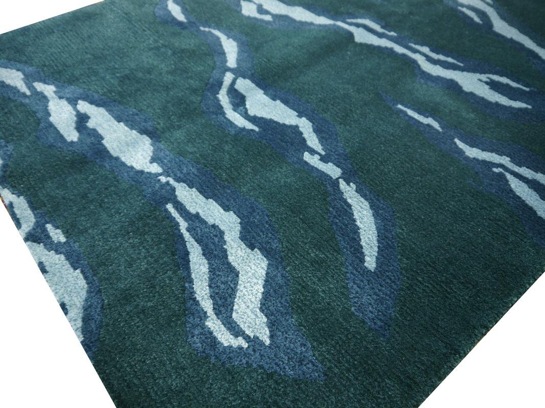 A contemporary modern design rug.

Size: 4 x 6 ft / 180 x 120 cm
Shape: Rectangular
Design: SPUME
Colors: Dark slate green, blue
Material: Silk (real natural mulberry silk 60%) Wool 40%
Construction: Hand-knotted
Customizable: Yes, on order in size