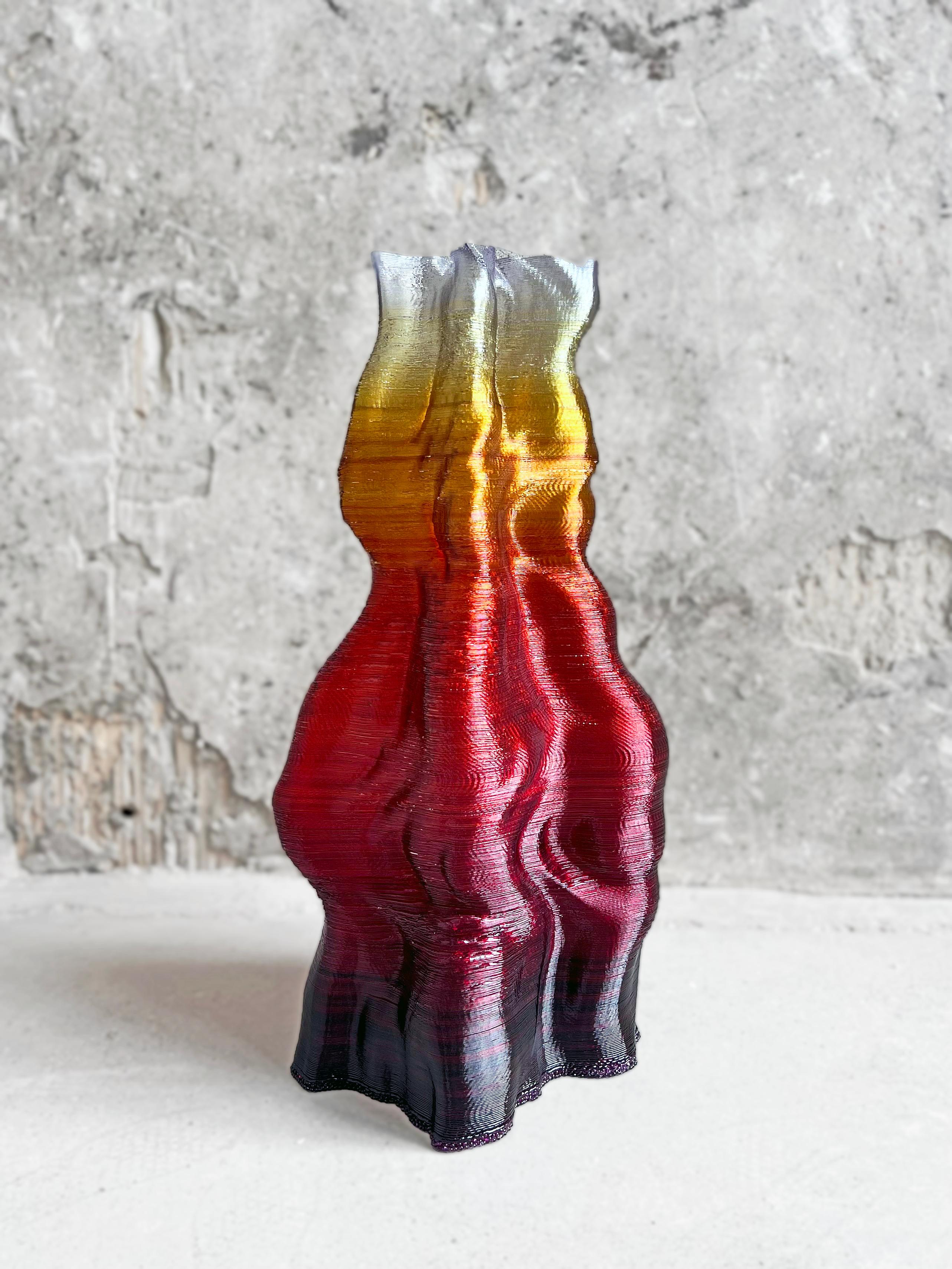 An organic-form vessel made from robotically extruded bioplastic hand-dyed by the artist during the extrusion process. Ruga Ignis is part of an ongoing vessel series designed and fabricated in the Oak Park, IL studio of Chicago/Detroit-based artist