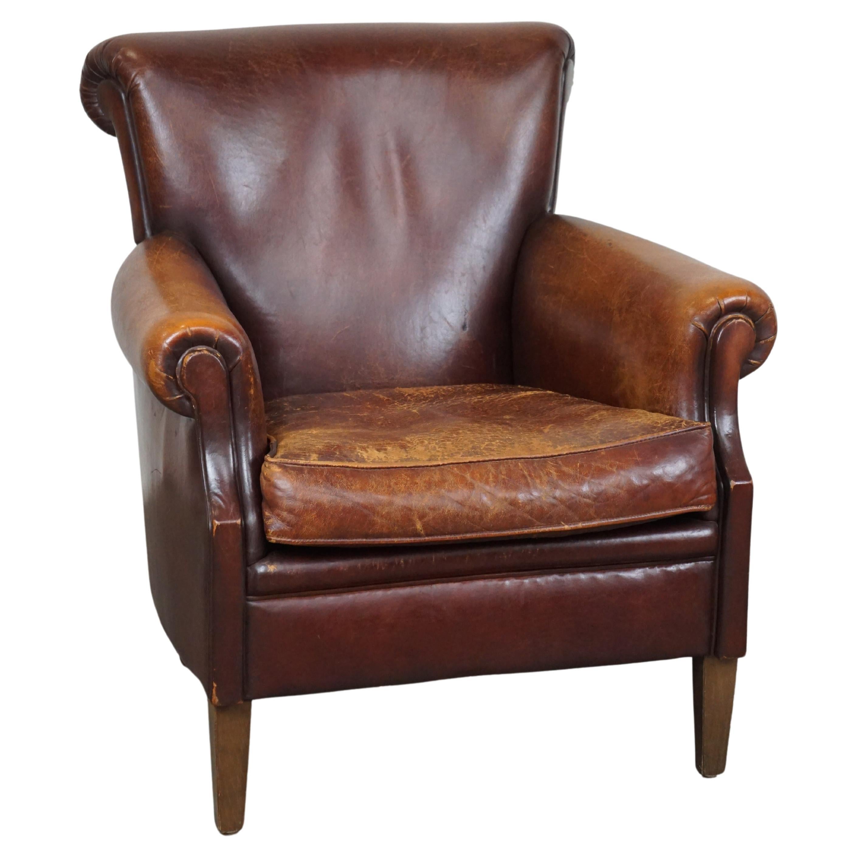 Rugged and Worn but Very Comfortable Sheepskin Leather Armchair 
