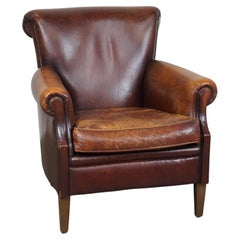 Rugged and Worn but Very Comfortable Sheepskin Leather Armchair 