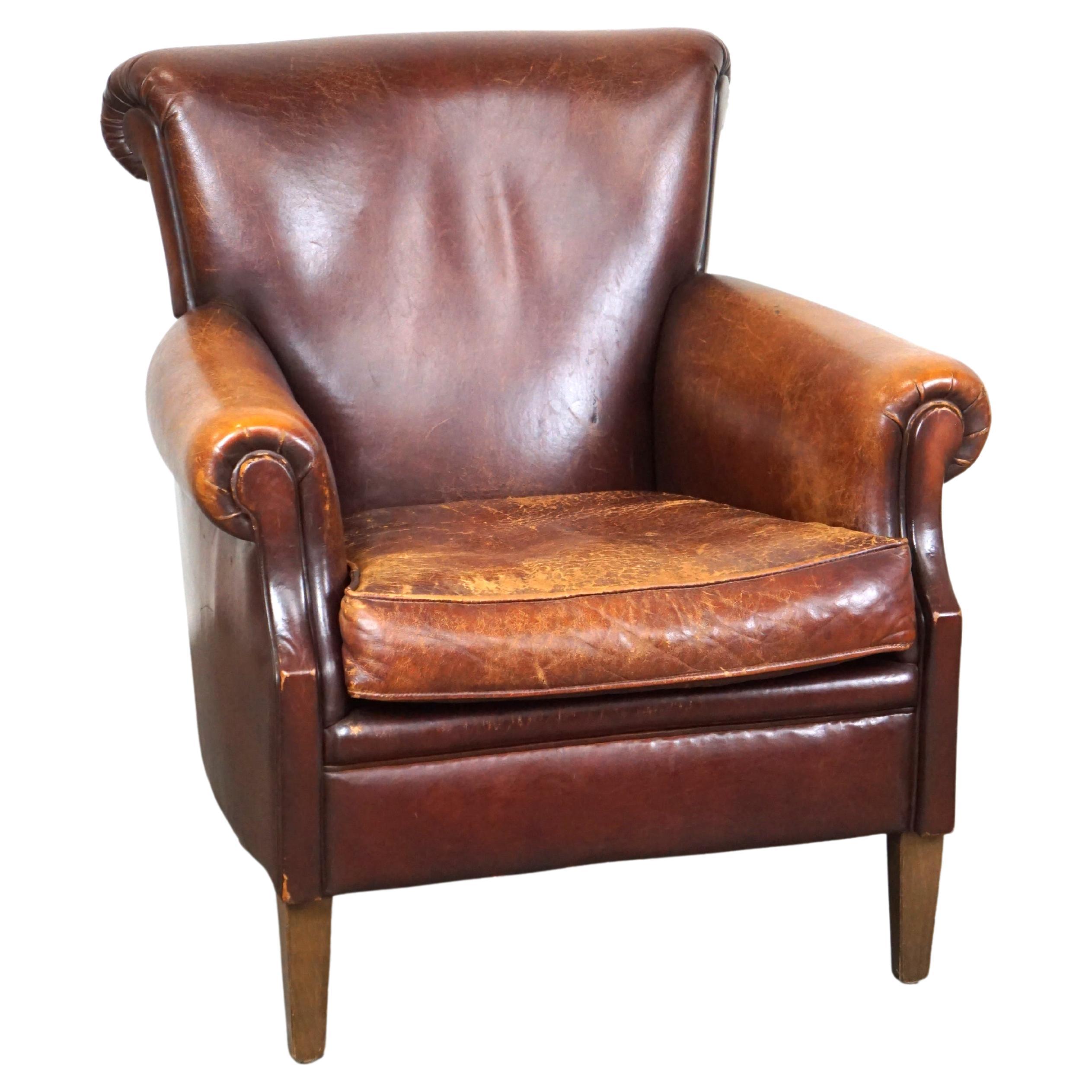 Rugged and Worn but Very Comfortable Sheepskin Leather Armchair