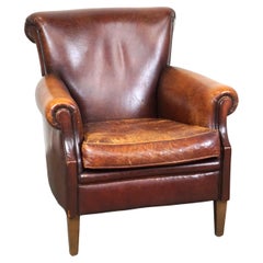 Rugged and Worn but Very Comfortable Sheepskin Leather Armchair