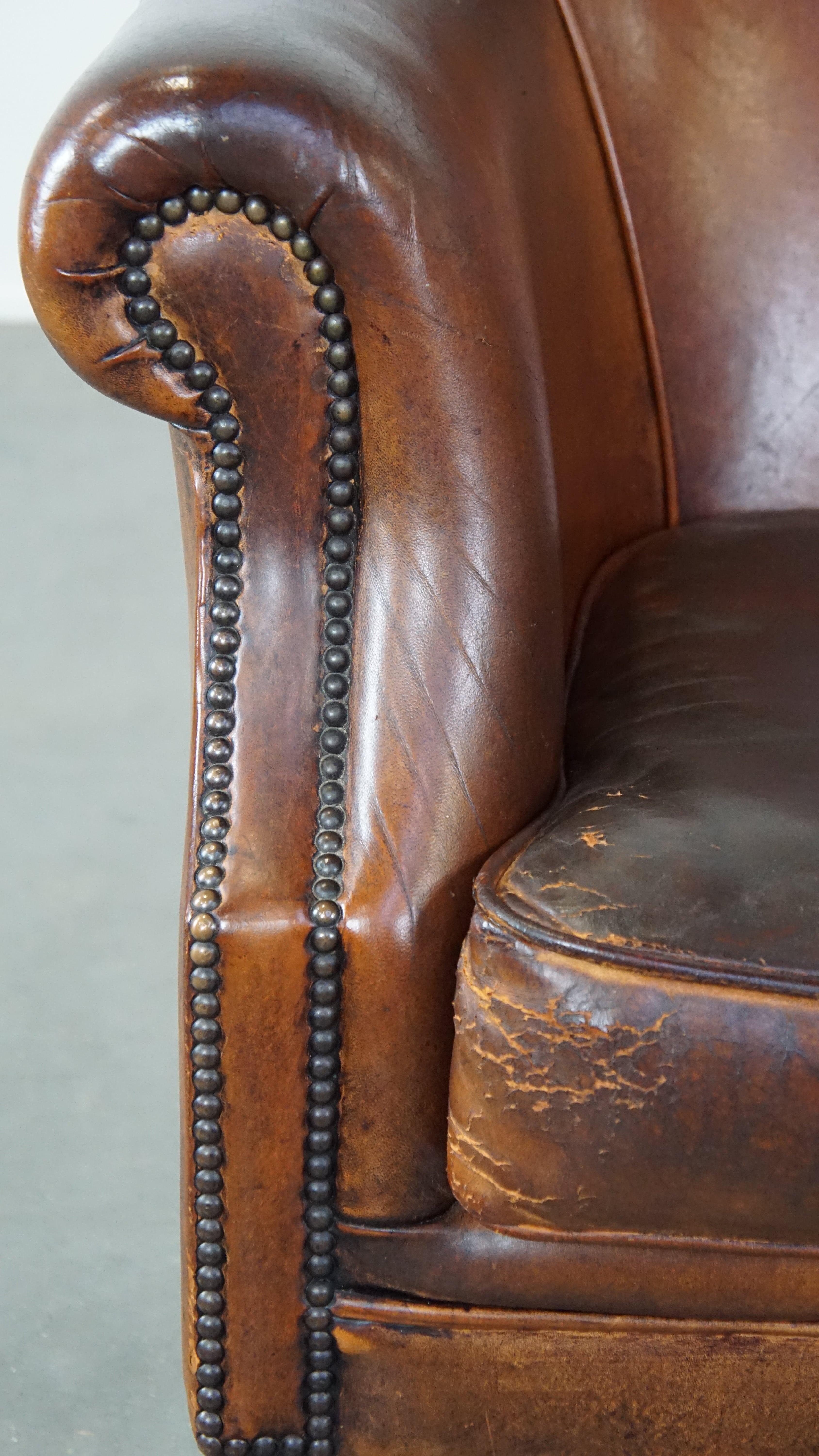 Rugged yet comfortable vintage club chair made of sheepskin For Sale 4