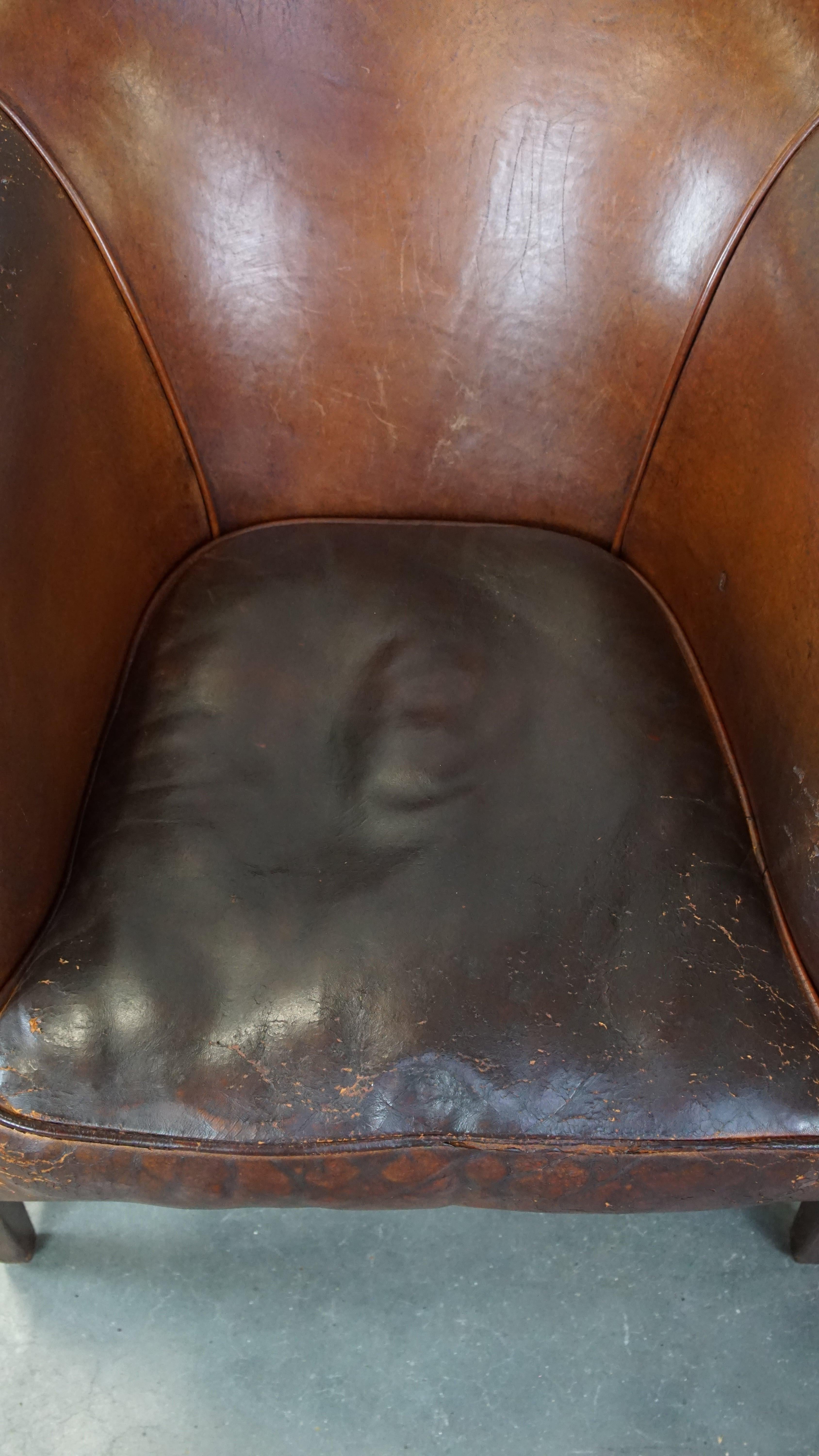 Sheepskin Rugged yet comfortable vintage club chair made of sheepskin For Sale