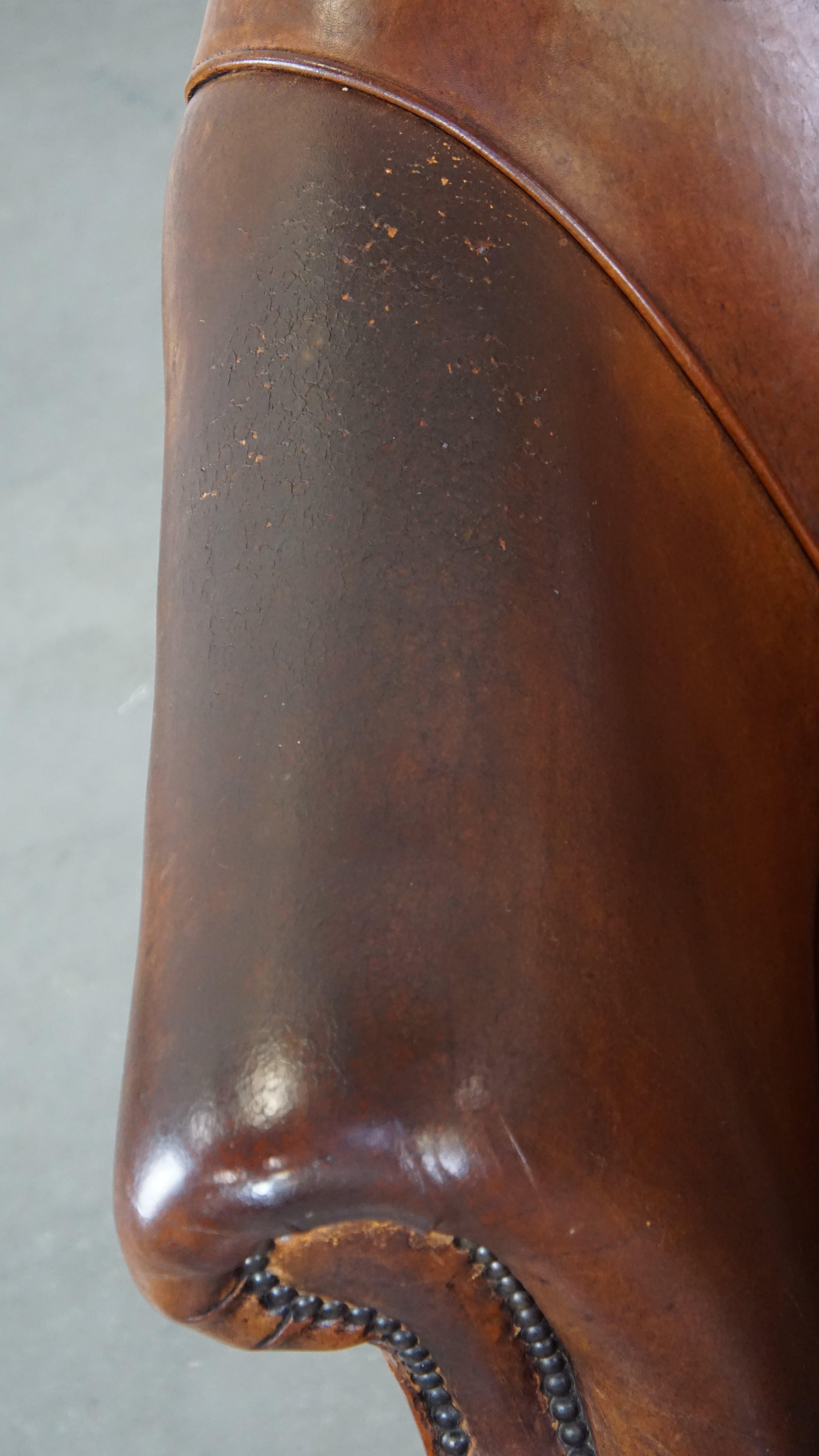 Rugged yet comfortable vintage club chair made of sheepskin For Sale 1