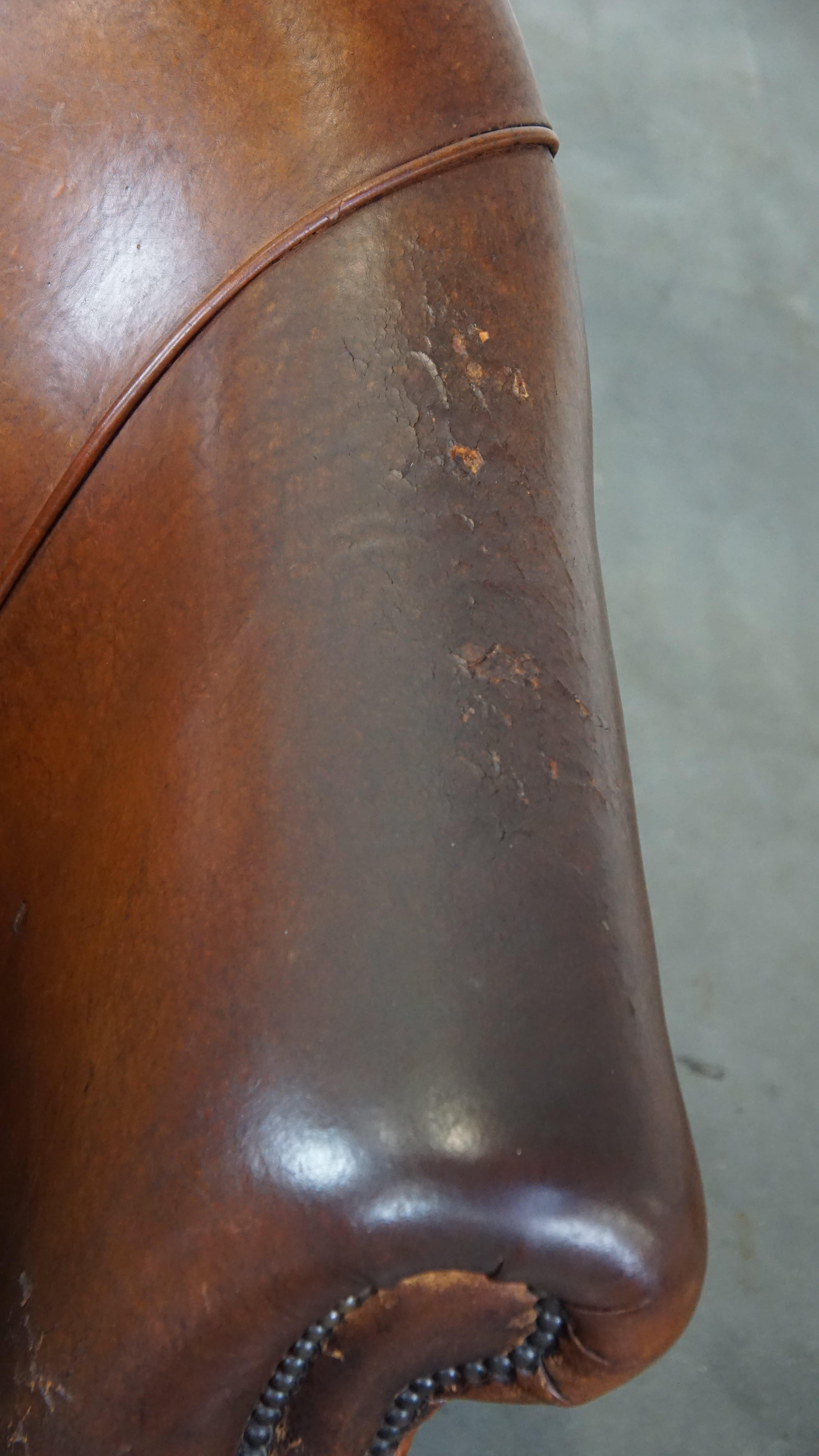 Rugged yet comfortable vintage club chair made of sheepskin For Sale 2