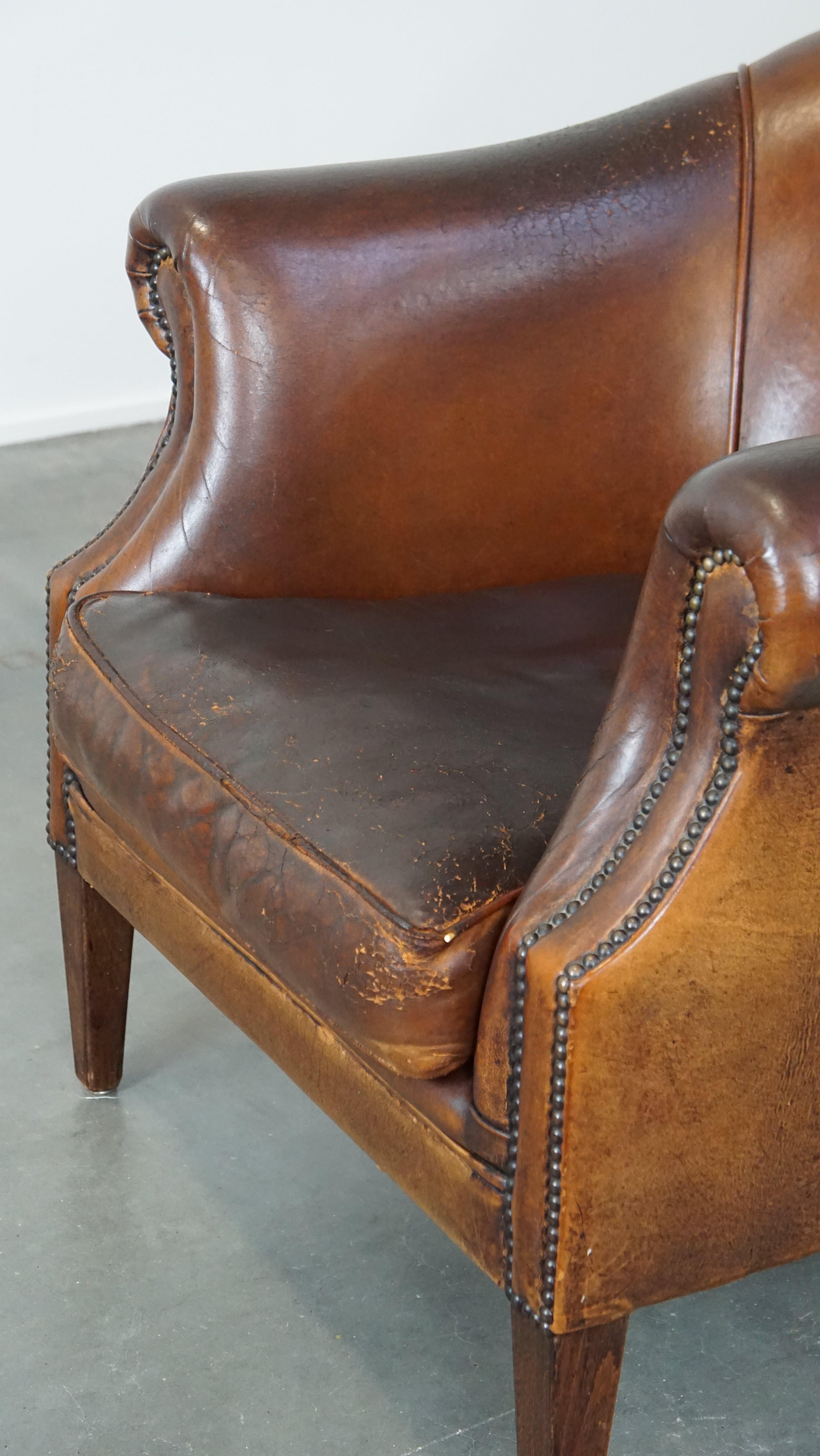 Rugged yet comfortable vintage club chair made of sheepskin For Sale 3