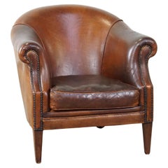 Rugged yet comfortable vintage club chair made of sheepskin