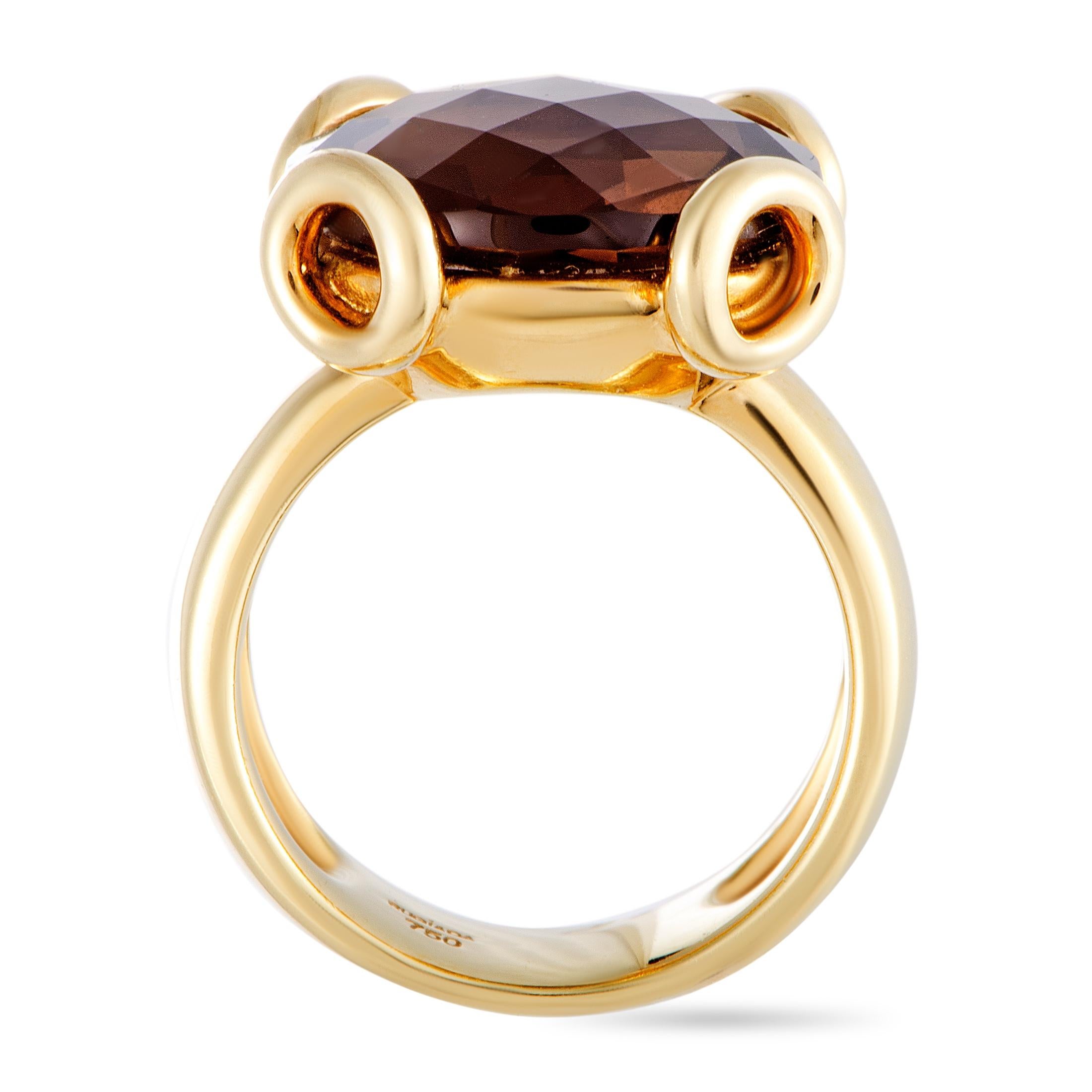 This Rugiada ring is made of 18K yellow gold and set with a smoky topaz. The ring weighs 13.1 grams, boasting band thickness of 6 mm and top height of 6 mm, while top dimensions measure 15 by 15 mm.

Offered in estate condition, this jewelry piece