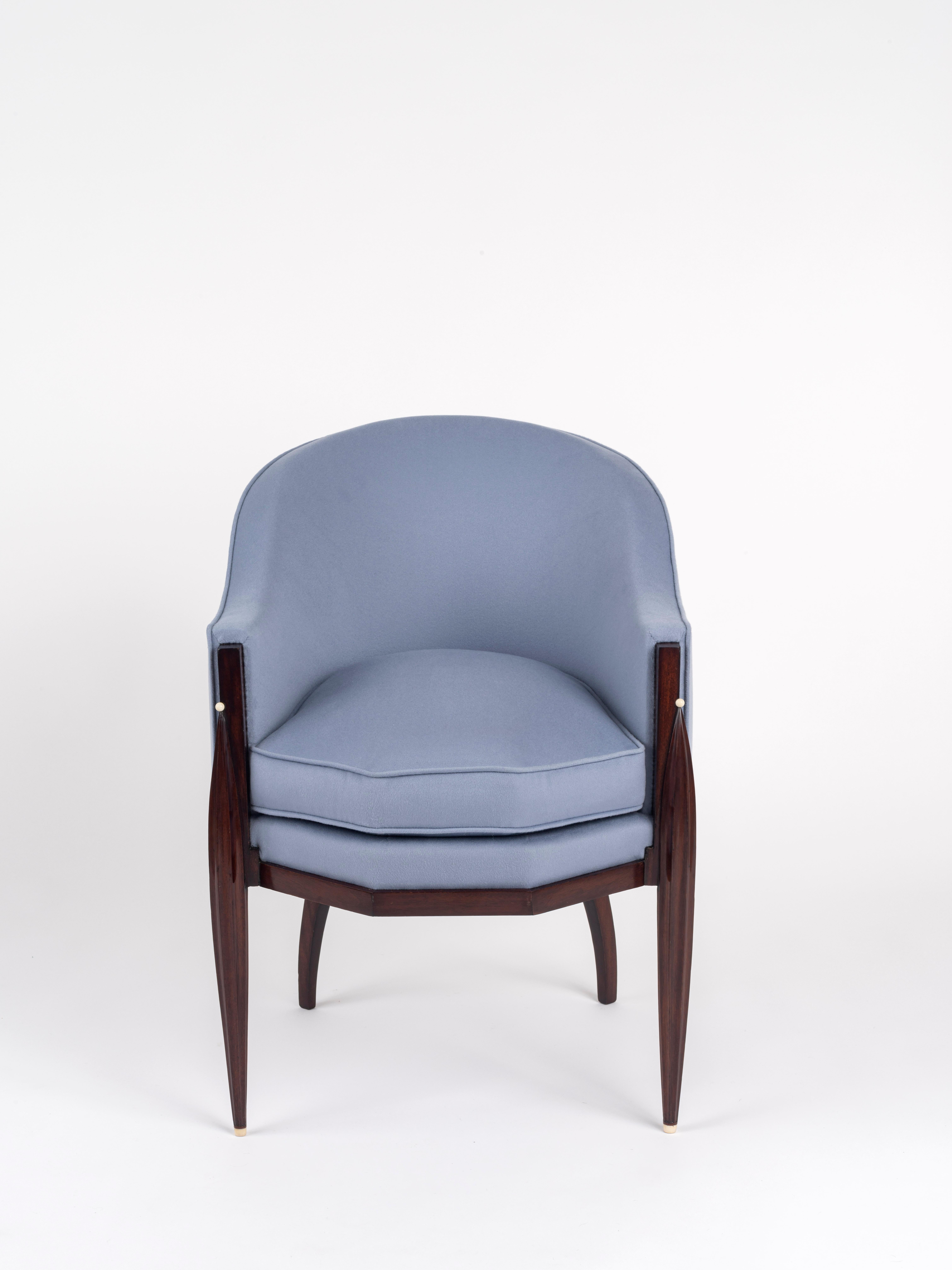 ‘Fuseau- Facettes’ armchair in solid amaranth, ‘Monsieur’ model, upholstered with Loro Piana purple cashmere, gondola back, and waist with cut sides, the two front legs tapered and fluted, decorated with a vegetable ivory bead and with vegetable