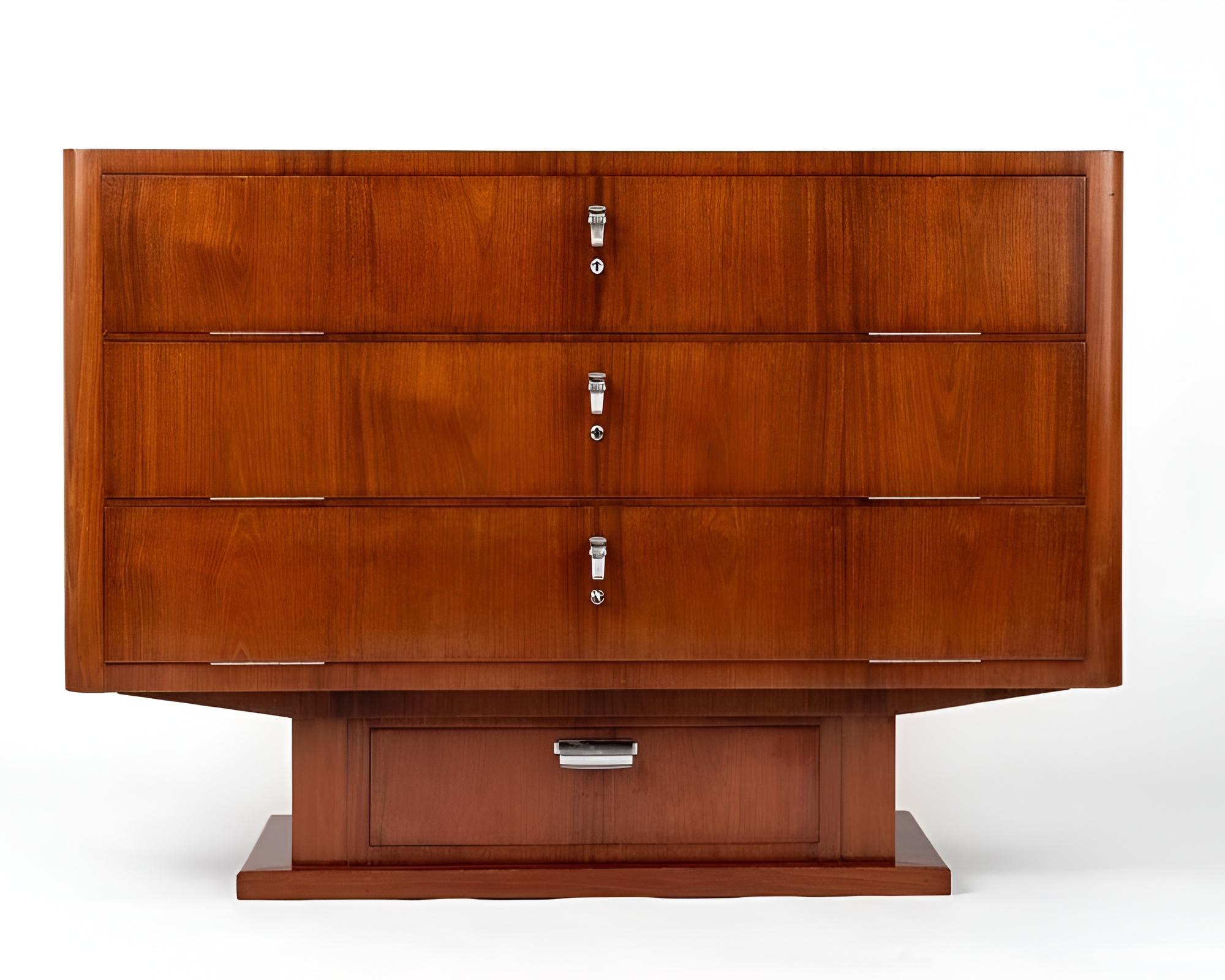 Unique 'Pagonau' model chest of drawers. Modernist variant of the Van Beuningen model with a quadrangular case in mahogany veneer. Opening at the front with three hinged drop-front panels, revealing an interior composed of sliding drawers in