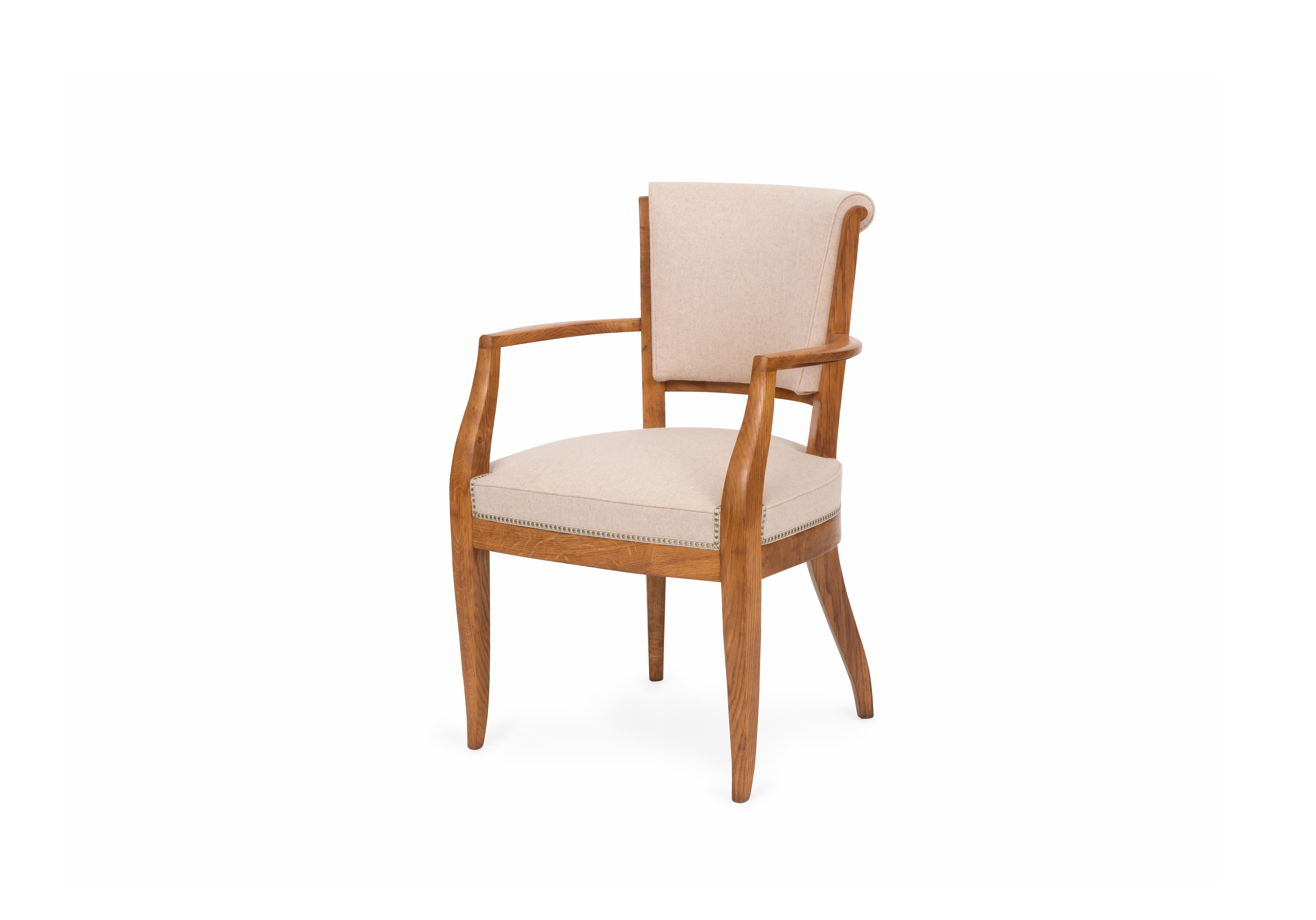 Pair of elegant 'Ledroua' model armchairs in oak, upholstered in light beige fabric. Stamped. Model created circa 1924.

Émile-Jacques Ruhlmann (1879-1933) was a French furniture designer and interior decorator and one of the most important and