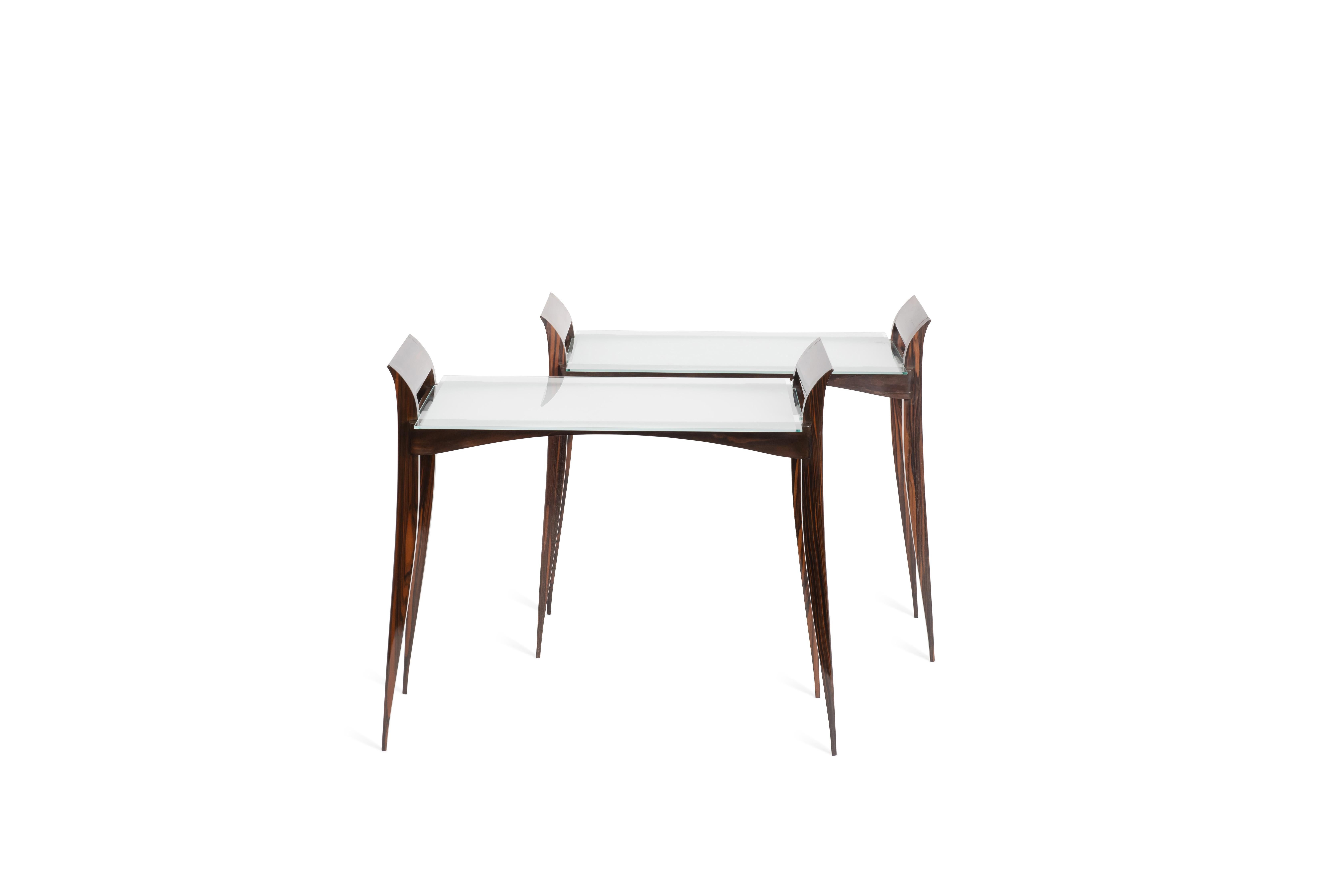 One small table ‘Rasson’  Model in Macassar ebony with glass top. The table was designed by Ruhlmann and edited by Porteneuve. Stamped 'Dessiné par Ruhlmann, Edité par Porteneuve'. Reference number 1218NR in the Ruhlmann Archives, Musée desAnnées