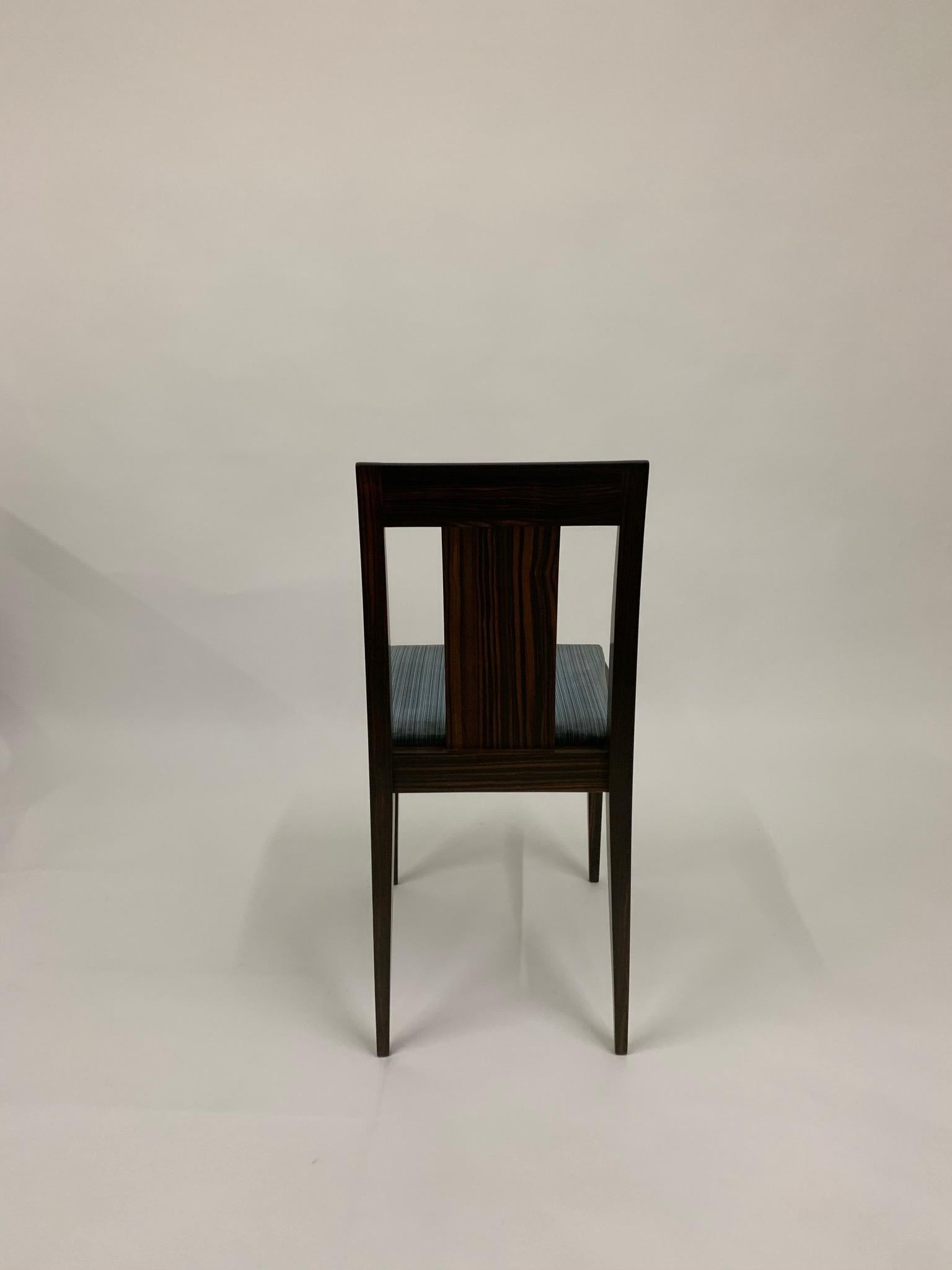Set of four chairs in Macassar ebony.This model was created for the sculptor Joseph Bernard, as a variant of the model made for the pavilion of the Cité Universitaire. Stamped 'Ruhlmann'. 
Provenance: Model commissioned by Mr. Antonin Lagier,
