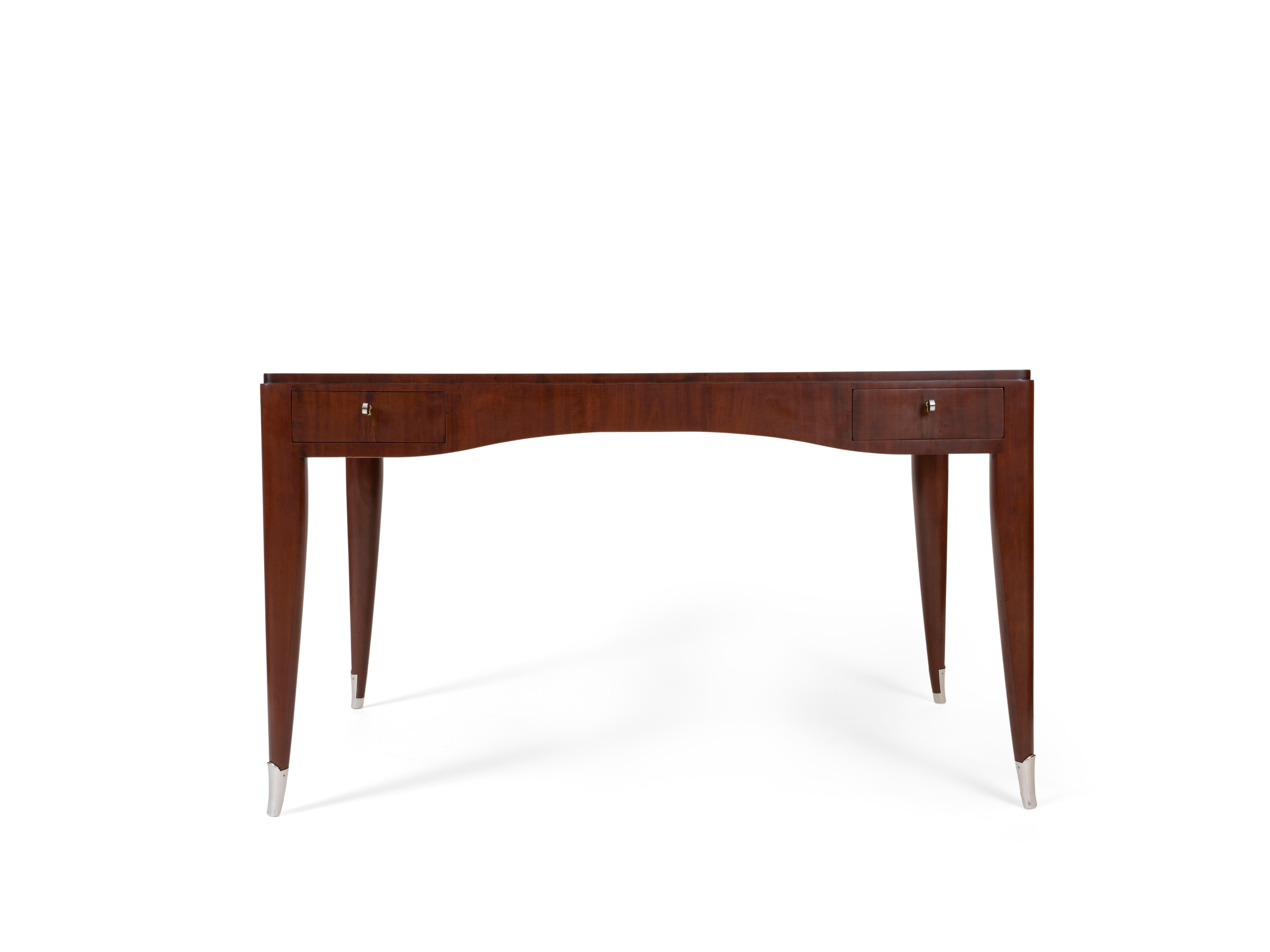 'Sulzer' Desk in honduran mahogany with silvered bronze details.
Referenced in the Ruhlmann Archives under 1504NR.
Stamped Ruhlmann with the Atelier A mark and dated 1932 on the underside.
Provenance: Mr Sulzer, Paris
Claude Boisgirard, 22 October