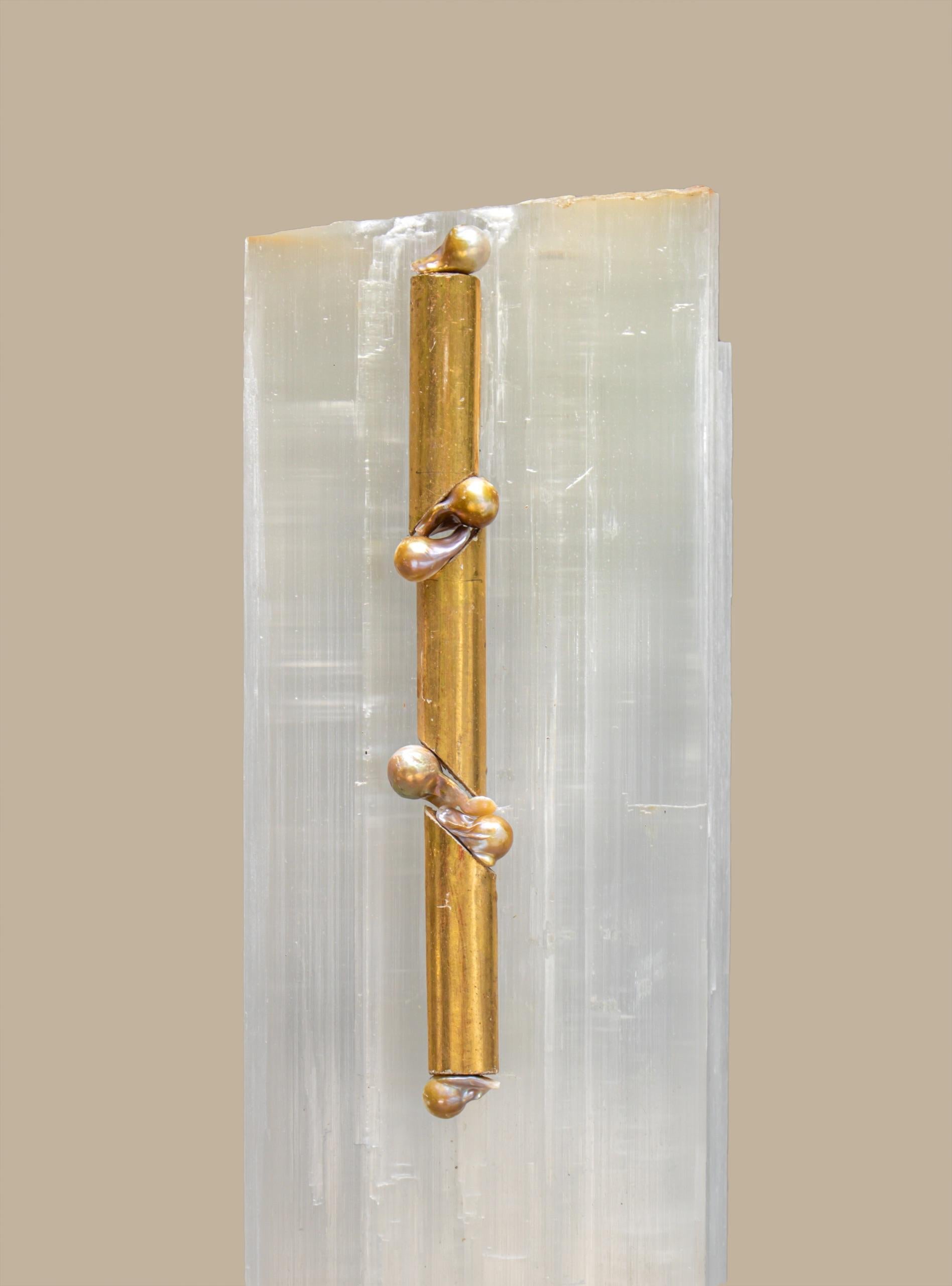 Ruler Selenite with an 18th century Italian gold leaf fragment molding and natural forming baroque pearls on a lucite base. Ruler selenite or 