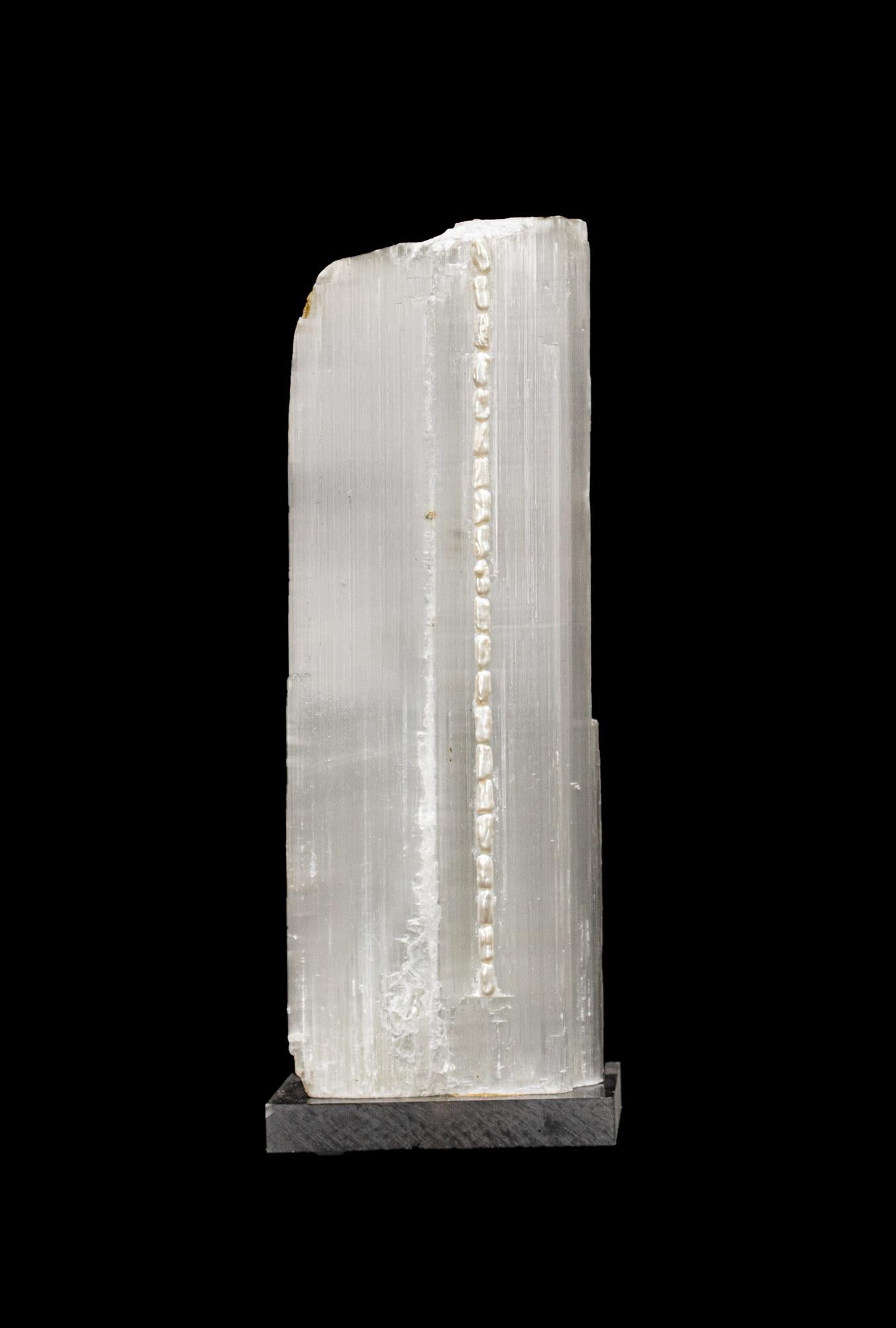 Ruler Selenite with natural forming baroque pearls on a lucite base. Ruler selenite or 
