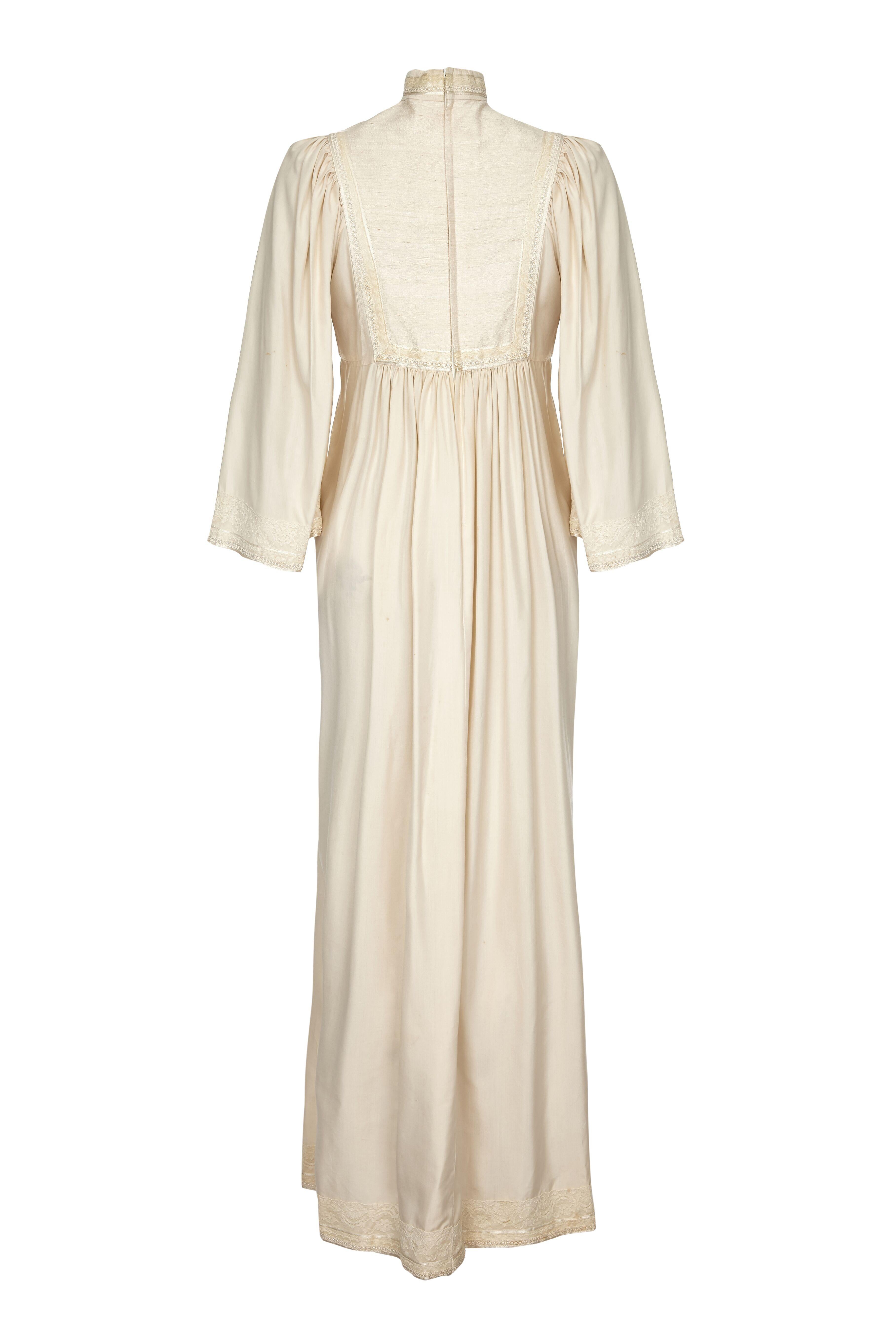 This enchanting 1970s silk smock dress in pale ivory silk from Rumak and Sample has a soft feminine line and presents beautifully as a vintage bridal piece. The embroidered bodice, high collar, bell sleeves and empire waistline create a romantic,
