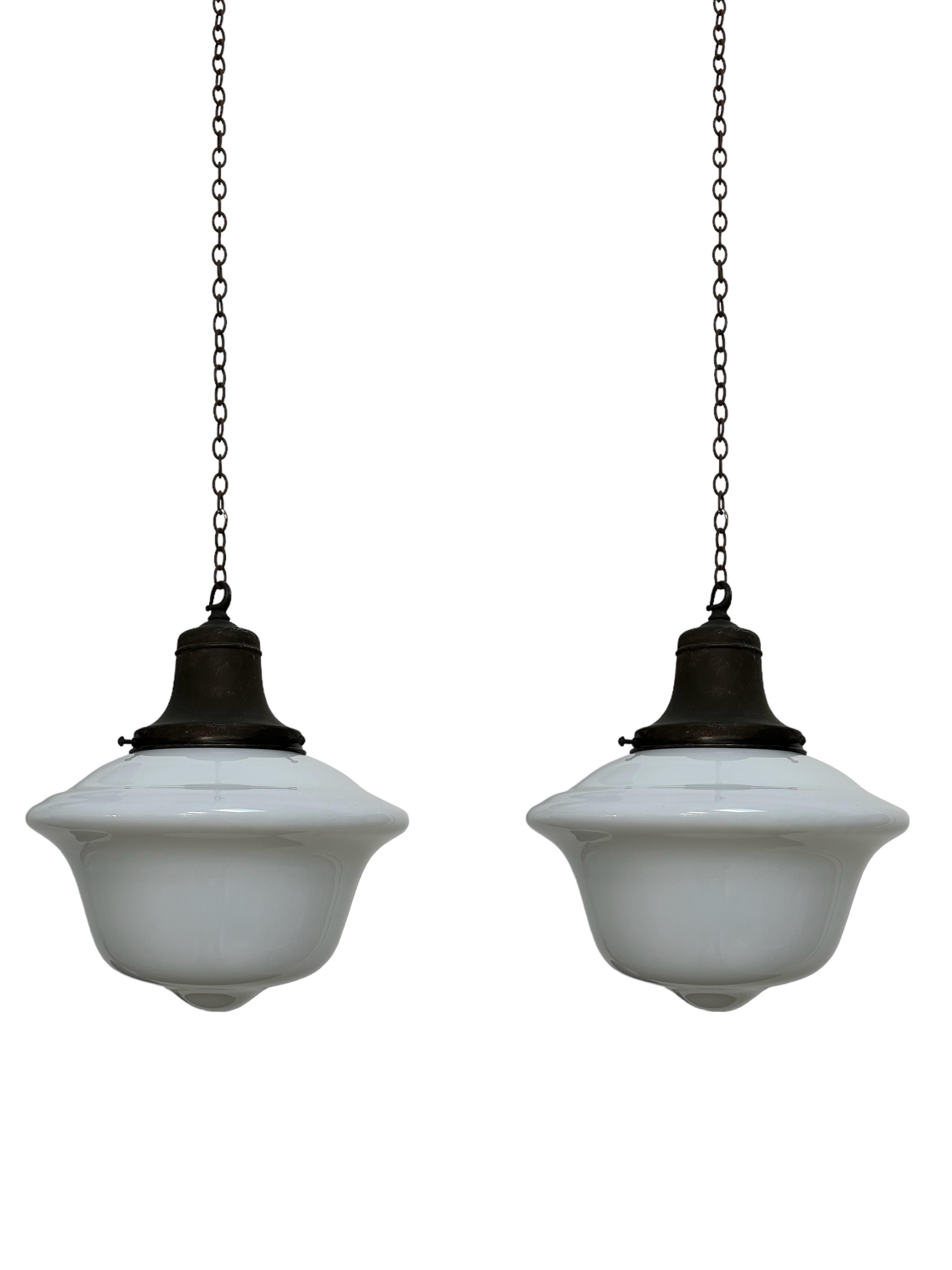 - A beautiful scarce run of school house opaline ceiling pendants with original galleries, England circa 1930.
- Wear commensurate with age, all in very good condition, lovely deep shape to the opaline glass.
- Rewired with dark brown braided flex