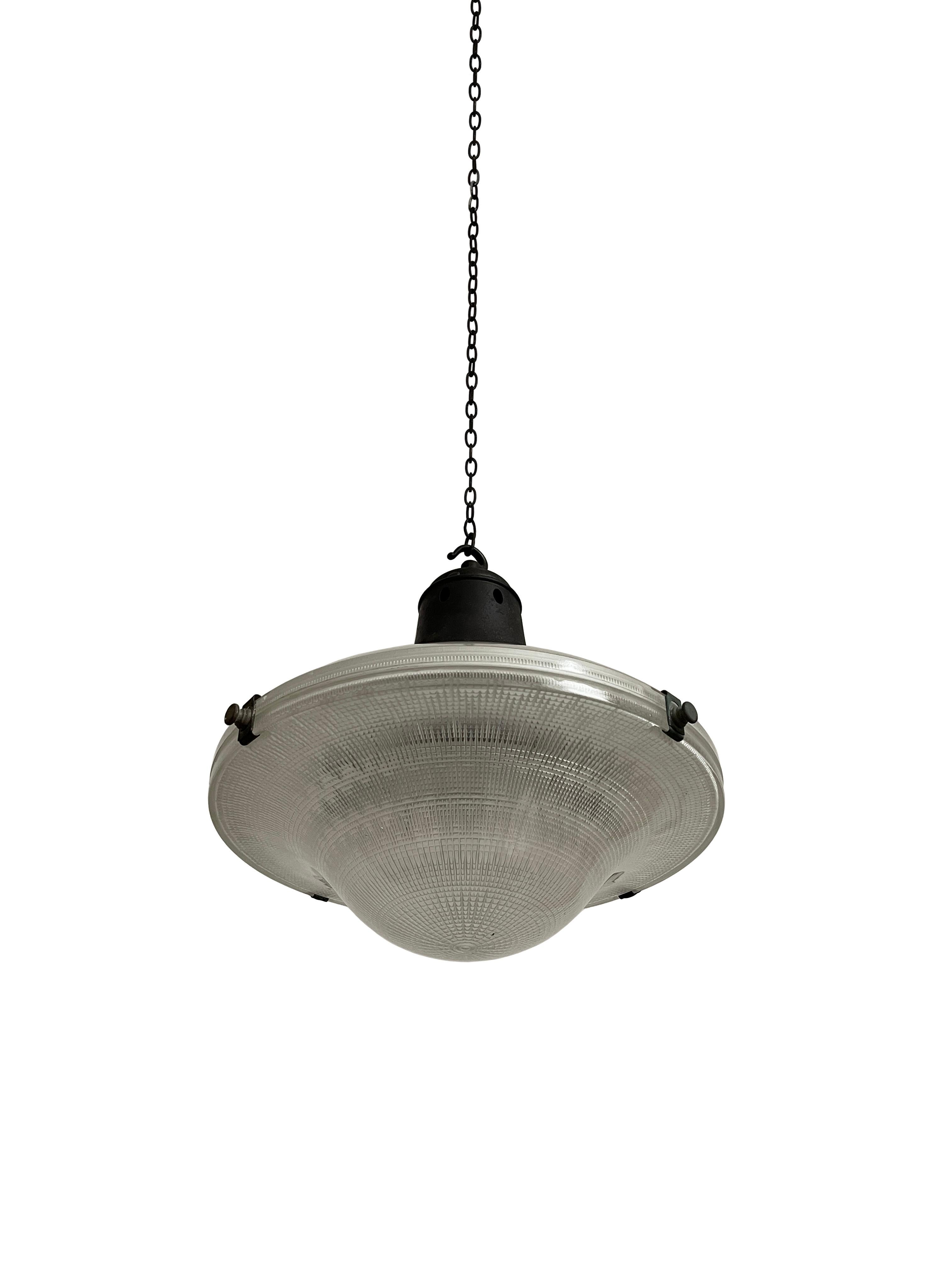 - A large Sistrah pendant with opaline and clear glass designed by Otto Müller, Germany circa 1930.
- A unique characteristic of the lamp is that it consists of five glass elements, the upper section being opaline and the transparent concentric
