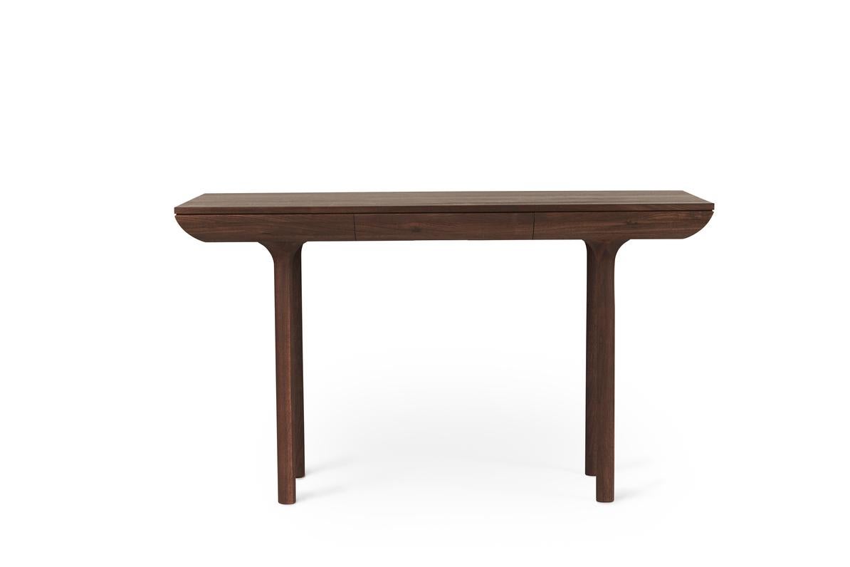 Rúna Oiled Walnut desk by Warm Nordic
Dimensions: D130 x W65 x H74 cm
Material: Oiled solid walnut
Weight: 37 kg
Also available in different finishes. 

Timeless desk with a poetic idiom and a neat little drawer. With its pure and classic