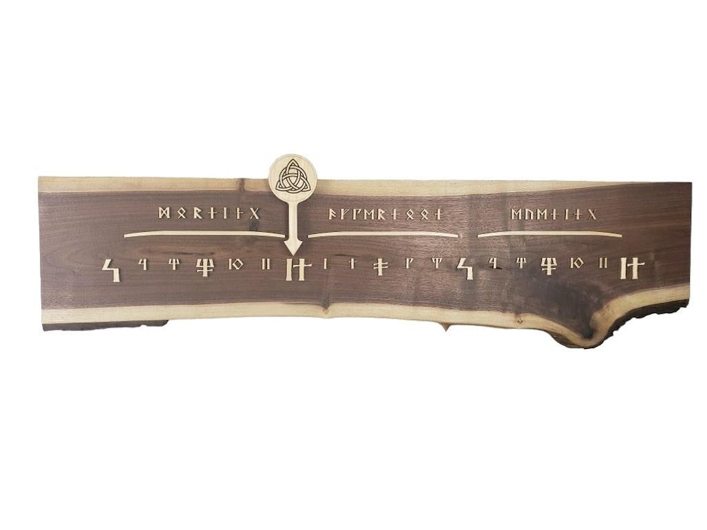 Runic is a Linear Clock featuring a beautiful length of dark Walnut, with an intriguing lower edge, makes up this very unusual clock.

Linear Clocks are an invention of Linear Clockworks; these clocks tell time in a calm, simple, and elegant