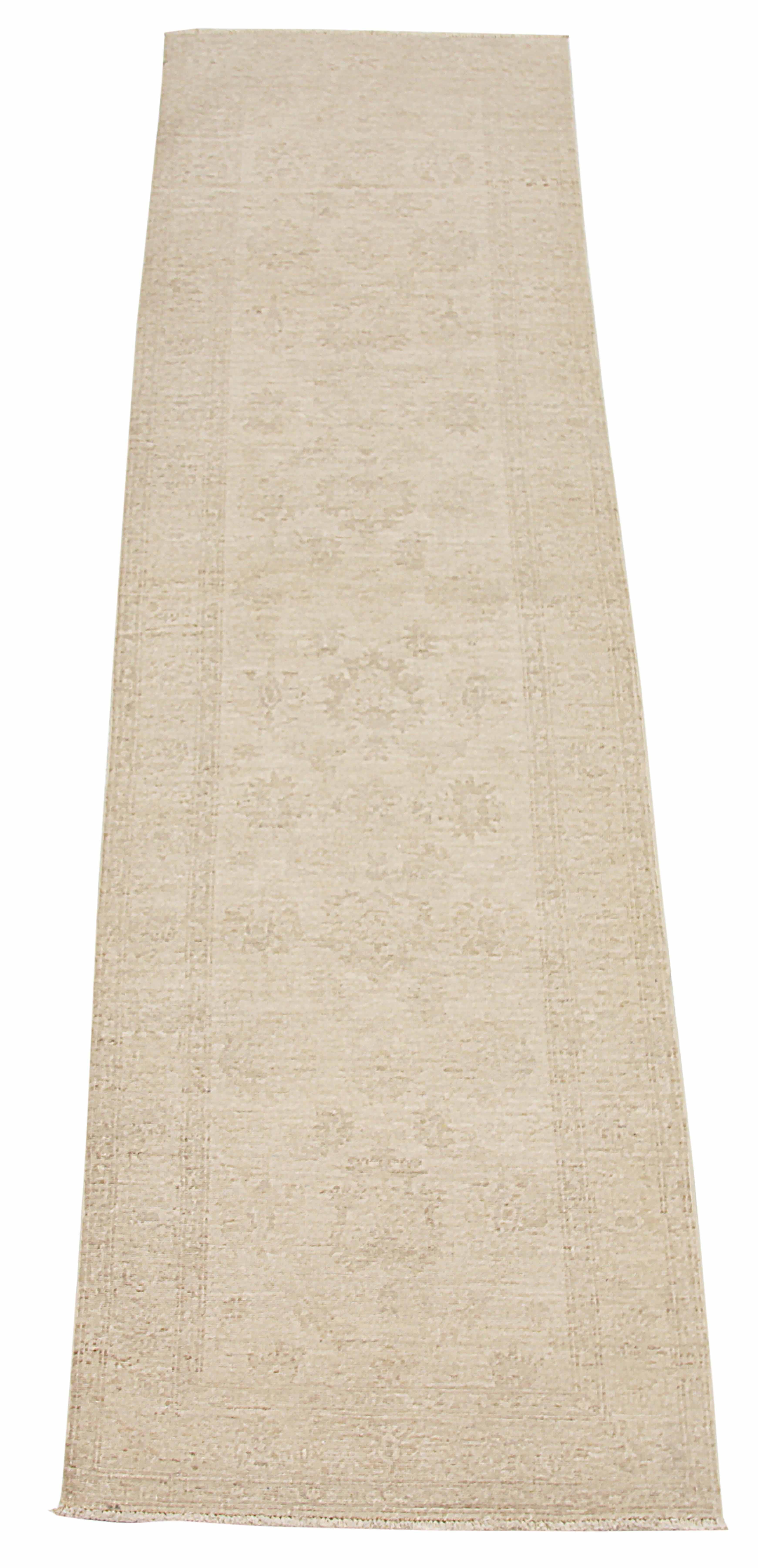 Introducing the traditional elegance of Farahan to your home with this handwoven runner rug. Expertly crafted from premium sheep's wool and colored with all-natural vegetable dyes that are safe for humans and pets, this runner rug is both visually