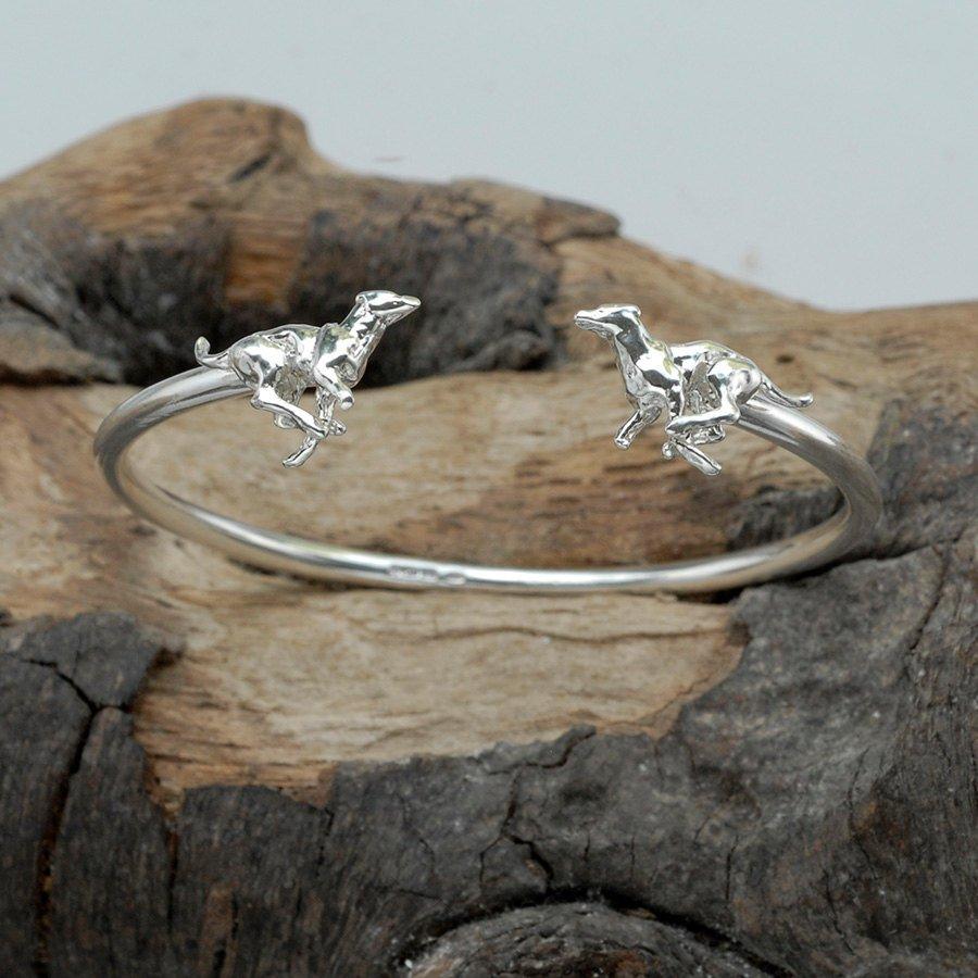 A robust, realistic Running Greyhounds bangle with presence, handmade in solid Sterling Silver. A beautiful bangle for the lover of these wonderful speedy dogs. 

Simon has achieved a beautiful combination of crisp detailing and robustness which