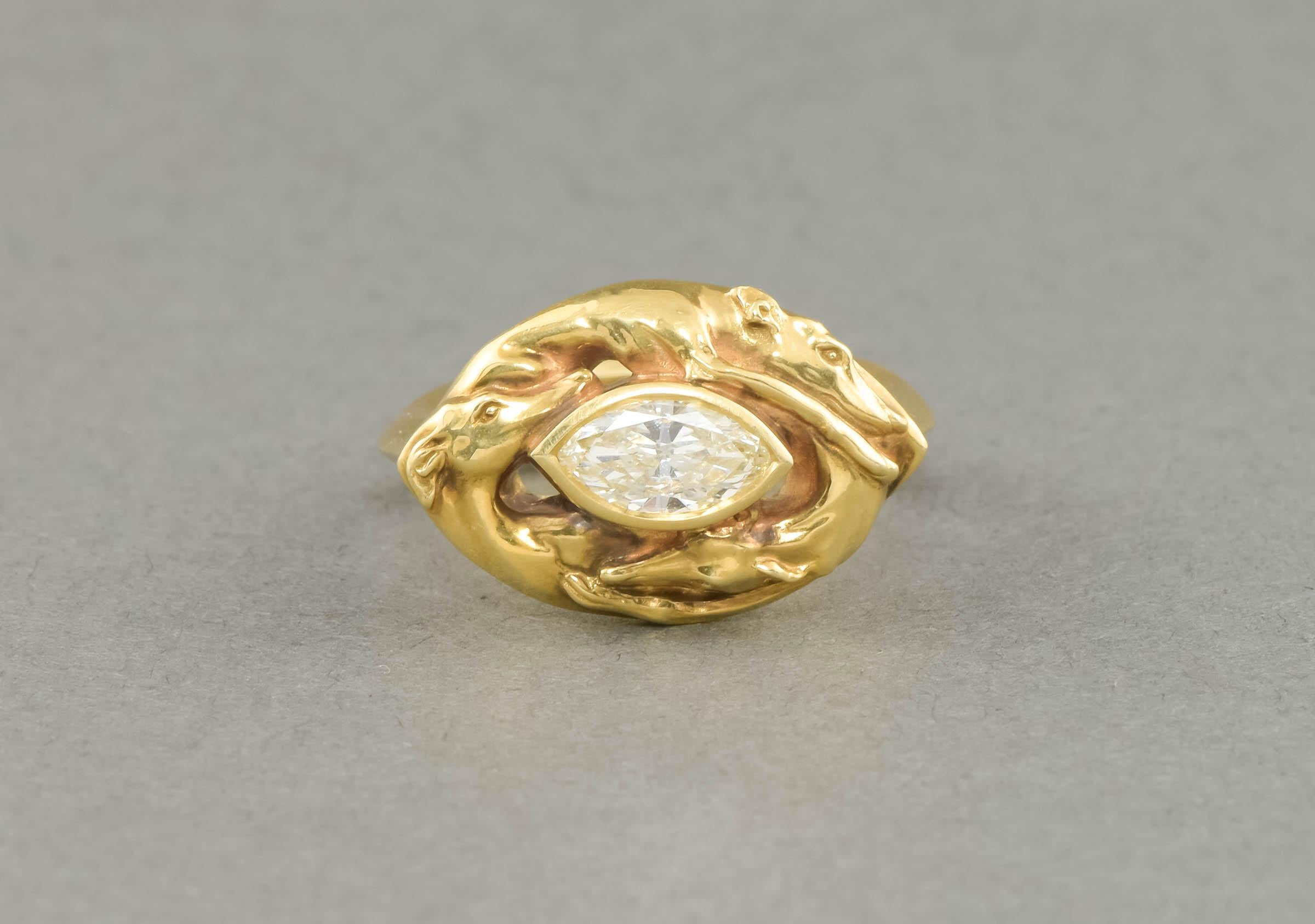 Inspired by an ancient ceramic Greek dogs-head chalice at the Getty museum, this marvelous ring was designed and hand carved by the talented jeweler Cheyenne Weil.  Weighty and substantial, the ring features a GIA certified marquise shaped brilliant