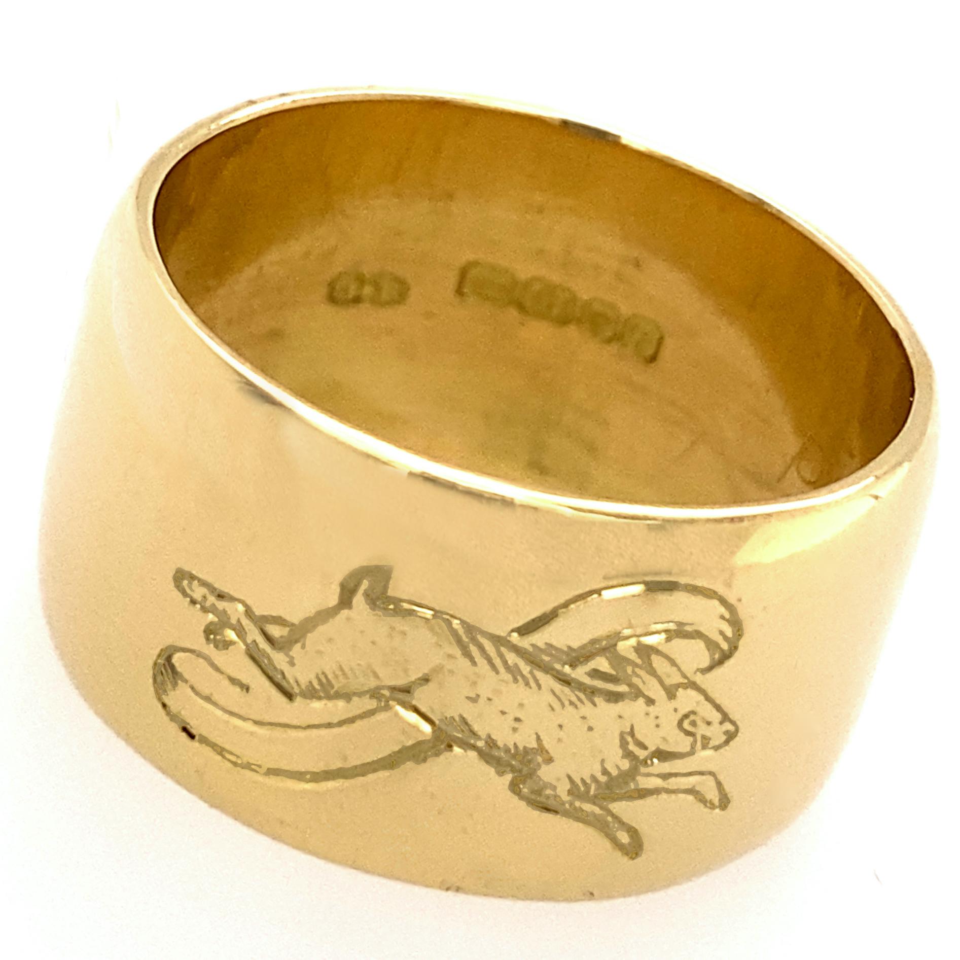 This unusual cigar band ring in polished 18 karat yellow gold features two different rabbit engravings.  

Rabbits symbolize wisdom, resurrection, mercy, beauty, abundance and prosperity, and lots of other good things.  Symbolism the world over has