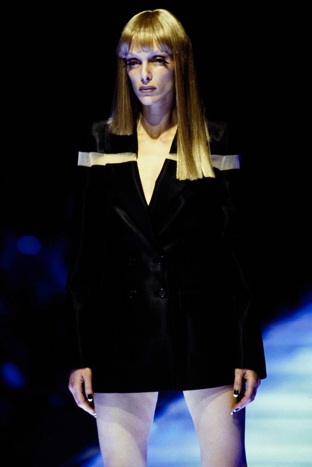 ALEXANDER MCQUEEN
From the Spring Summer 1998 'Golden Shower' Collection
Rare set completed with matching pinstripe trousers and blazer. Worn as a mini dress on runway.
Jacket: Wool, polyester, nylon, elastic. 
Black base with yellow pinstripe.