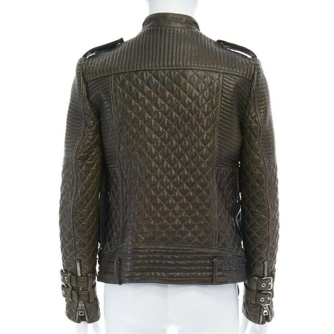 runway BALMAIN ROUSTEING green quilted leather motorcycle biker jacket EU48 M

BALMAIN BY OLIVIER ROUSTEING
FROM THE FALL WINTER 2014 RUNWAY
Lambskin, cotton, viscose. Dark green leather. 
Contrast quilring throughout. Asymmetric silver-tone zip