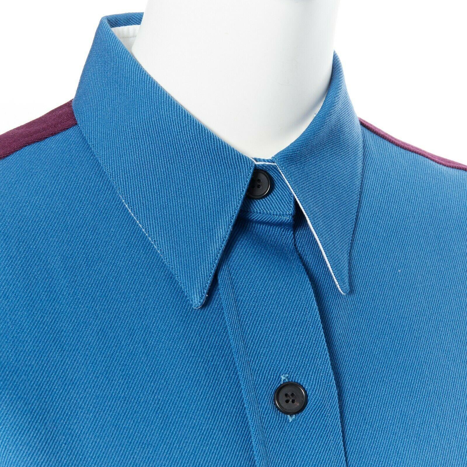 runway CALVIN KLEIN RAF SIMONS AW17 blue purple wool diner uniform shirt IT38 XS
Designer: CALVIN KLEIN205W39NYC BY RAF SIMONS
Model / Season: Fall / Winter 2017
Material: wool
Color: blue, purple
Pattern: plain
Description: Diner uniform shirt.