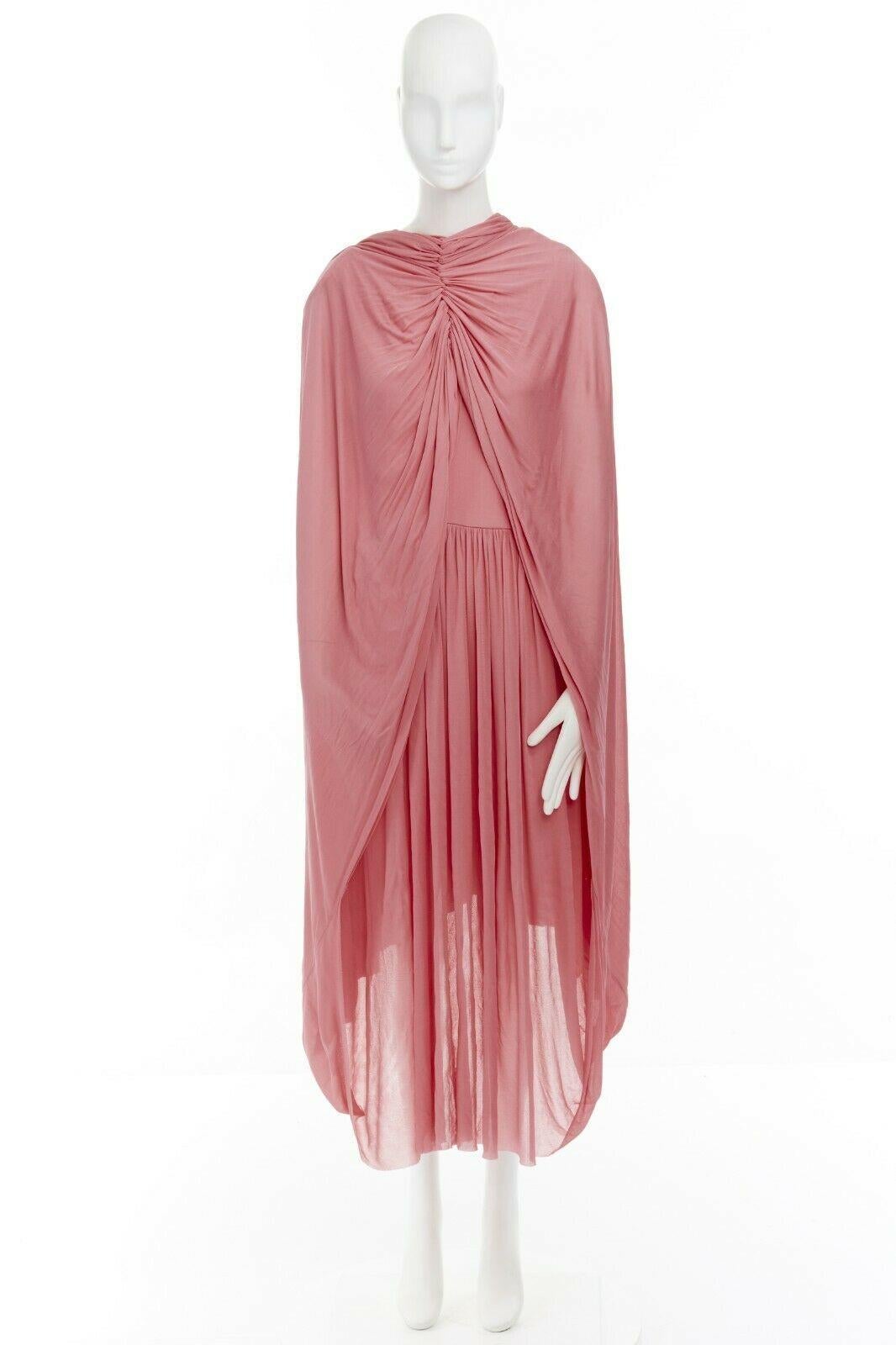 CELINE BY PHOEBE PHILO
Fluid cape dress. Pink viscose. V-neck. Sleeveless. Pleated skirt. Attached cape detail at skirt to be worn around neck. Concealed zip closure. Midi length. 
Made in France.

SIZING 
Designer size: FR36
Size reference: US0 /