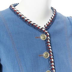 CHANEL 2013 - Veste en jean bleu à manches 3/4 avec bordures en tweed, taille FR 34 XS