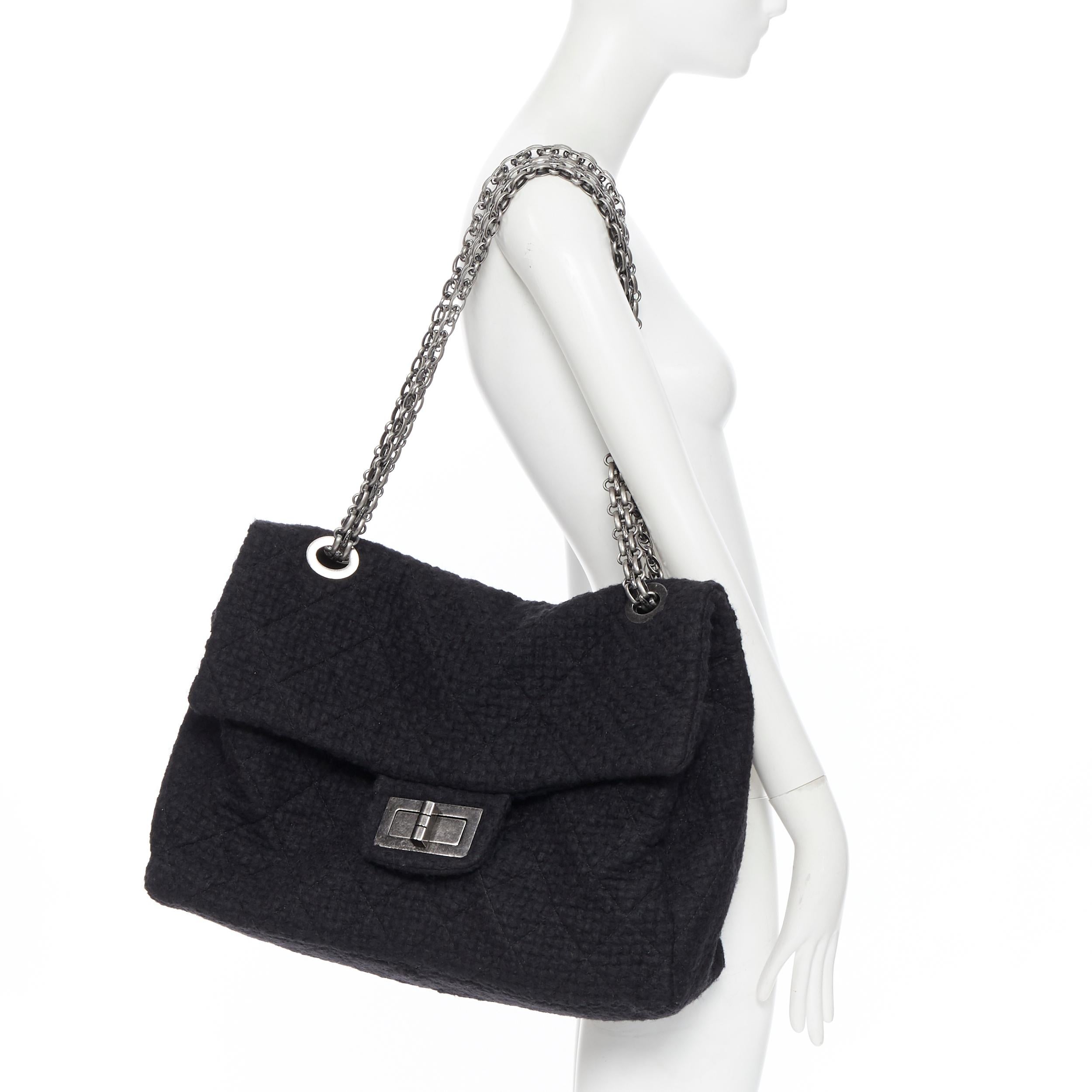 runway CHANEL 2.55 Reissue XXL black tweed quilted maxi silver chain flap bag
Brand: Chanel
Designer: Karl Lagerfeld
Model Name / Style: Reissue XXL
Material: Tweed
Color: Black
Pattern: Solid
Closure: Turnlock
Extra Detail: Extra large size.