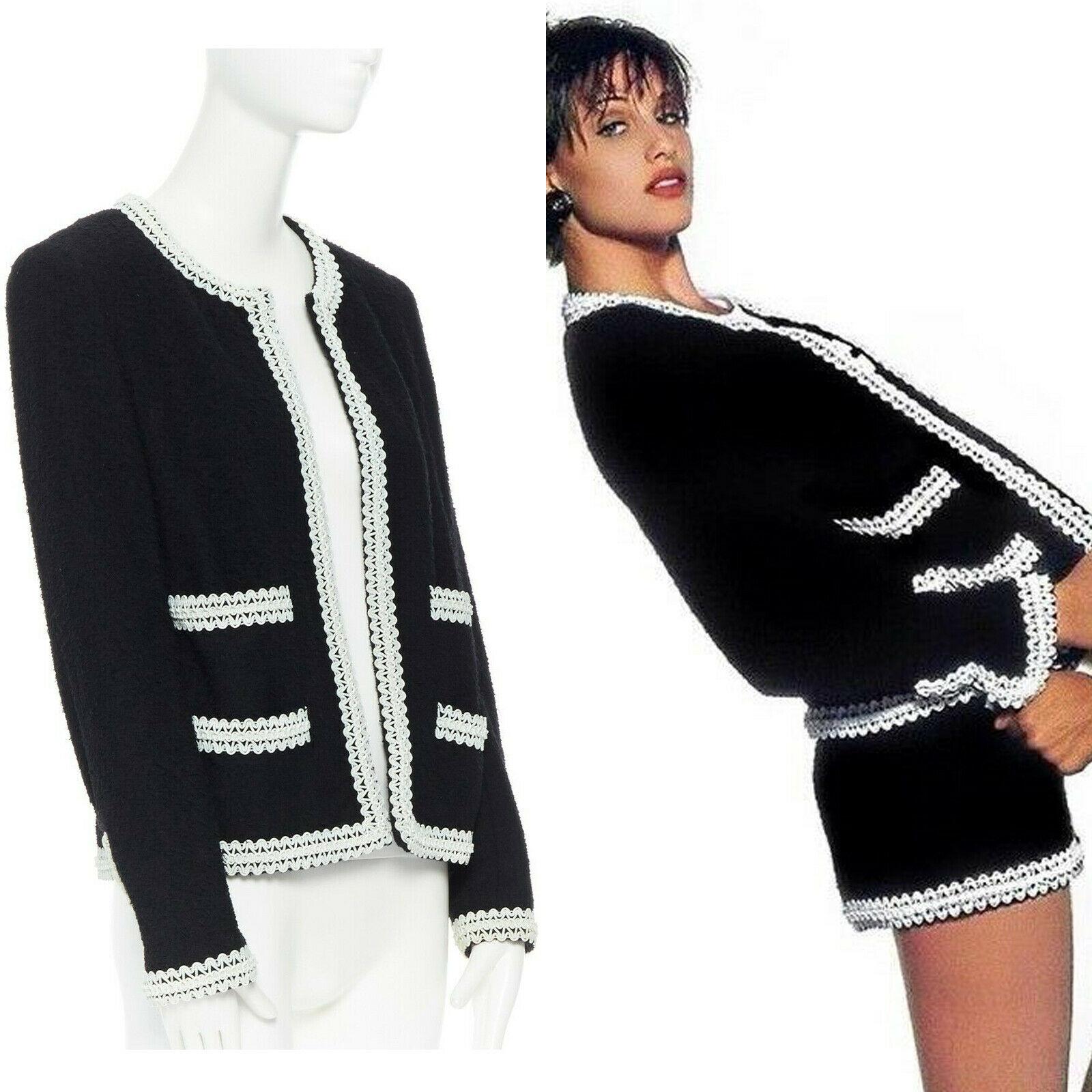 runway CHANEL 94P iconic black boucle tweed white rubber braid jacket FR38 rare
Brand: CHANEL
Designer: Karl Lagerfeld
Collection: 94P
Model Name / Style: Tweed jacket
Material: Wool tweed
Color: Black and white trimming
Pattern: Solid
Lining