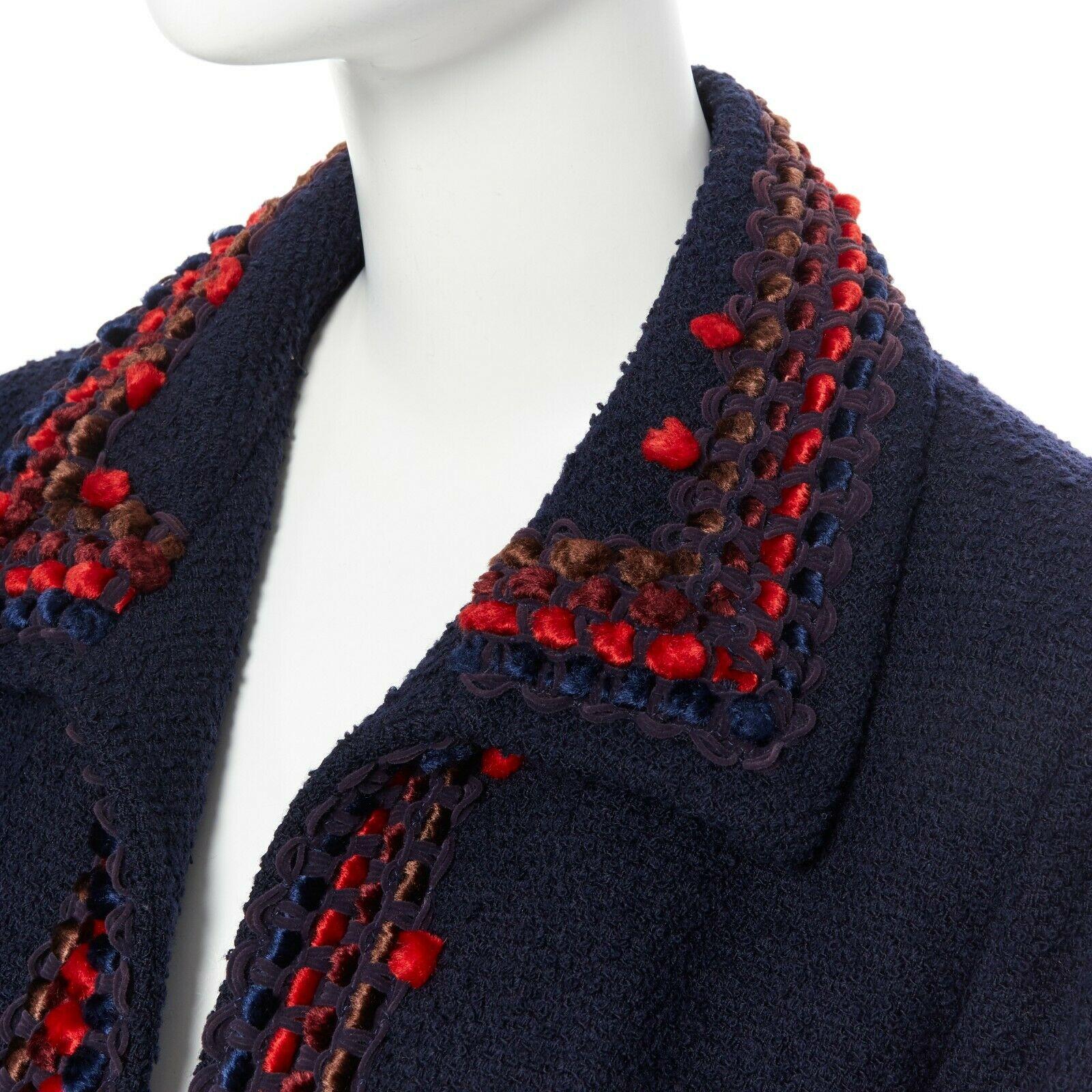 runway CHANEL 97A blue wool tweed multicolor pom-pom adorned crop jacket FR44
Brand: CHANEL
Designer: Karl Lagerfeld
Collection: 97A
Model Name / Style: Tweed jacket
Material: Wool
Color: Navy with red decoratives
Pattern: Solid
Lining material: