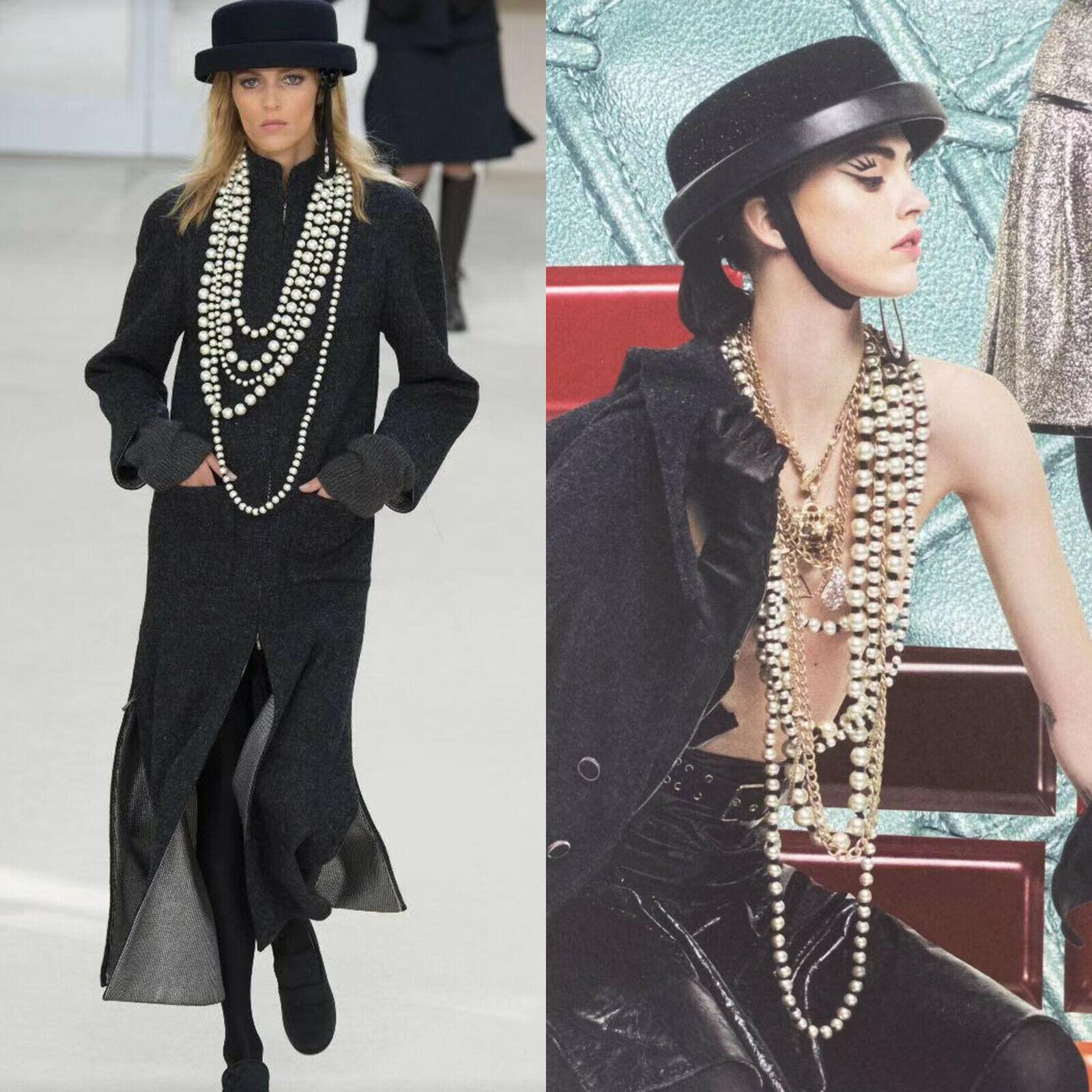 runway CHANEL oversized pearl black ribbon multi-strand statement necklace rare
Brand: CHANEL
Designer: Karl Lagerfeld
Model Name / Style: Pearl necklace
Material: Pearl; faux pearl and ribbon
Color: White
Pattern: Solid
Closure: Lobster 
Extra