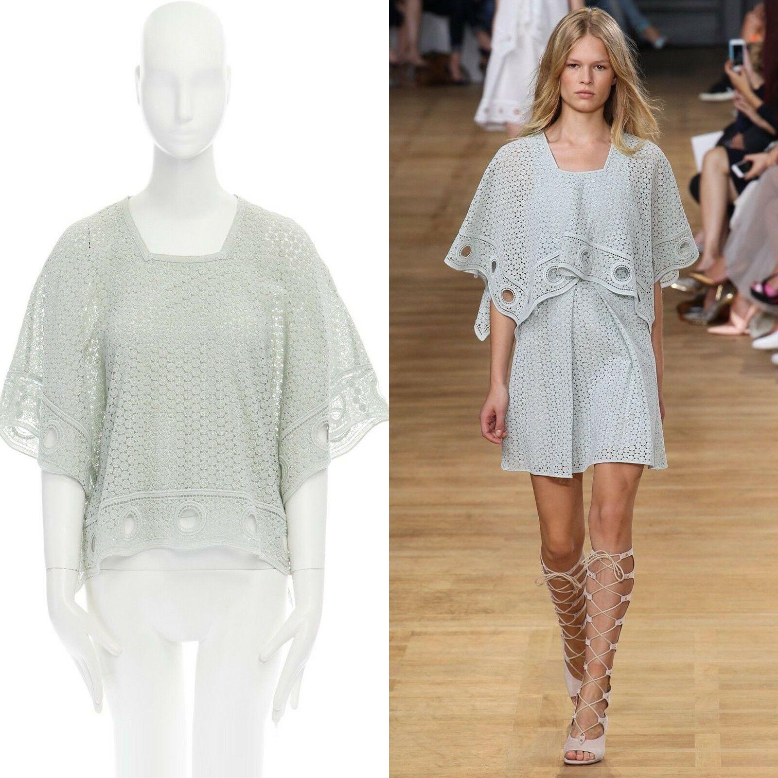 runway CHLOE SS15 teal blue crochet lace knit poncho capelet top FR36 US4 UK8 S
CHLOE
AS SEEN ON: SPRING SUMMER 2015 RUNWAY
COTTON, POLYESTER, SILK . 
TEAL BLUE . 
CROCHET KNIT .
ANGULAR NECKLINE . 
PONCHO SLEEVES . 
SLEEVELESS SILK TANK TOP .