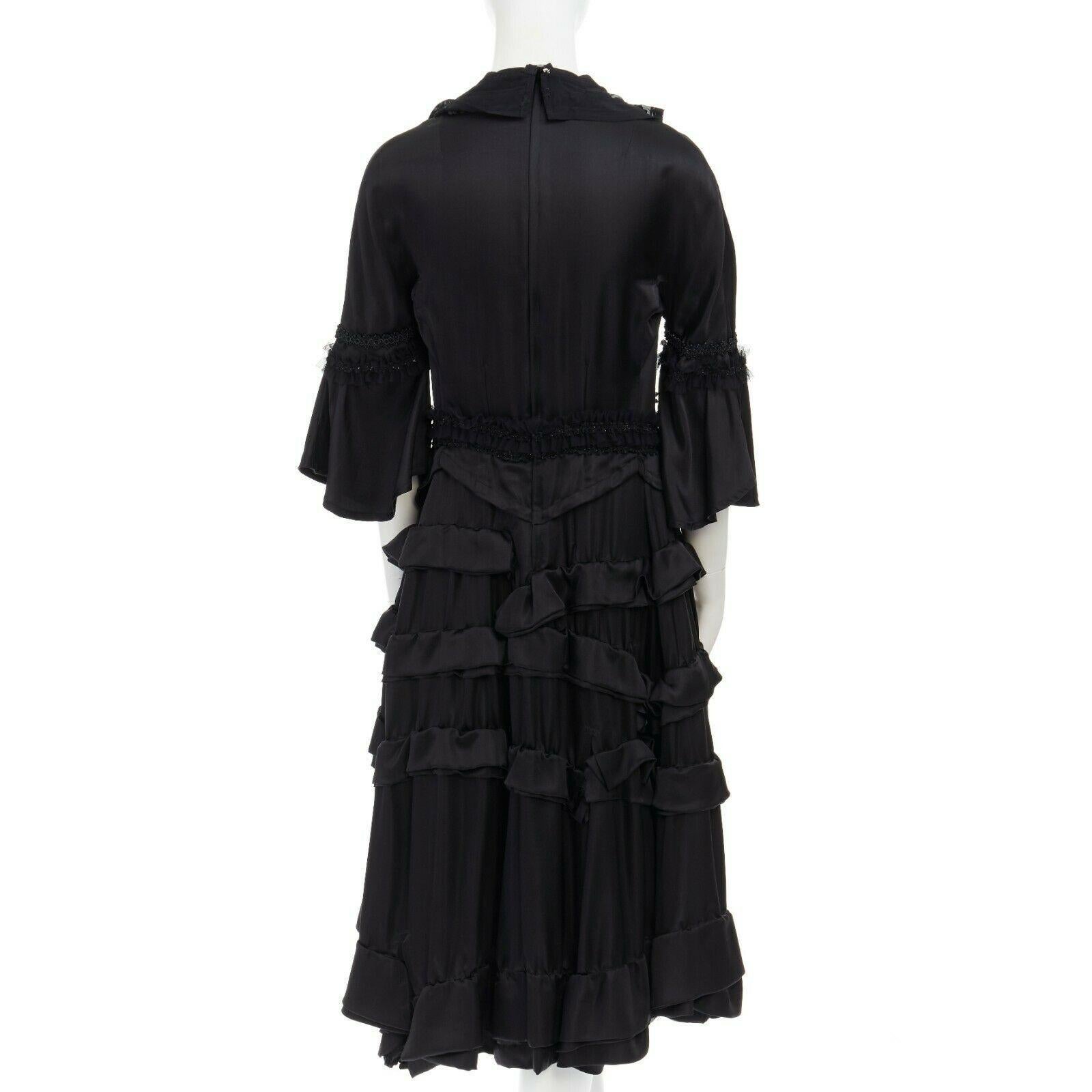 runway COMME DES GARCONS Broken Bride AW05 black victorian ruffle silk dress S

COMME DES GARCONS
AS SEEN ON: ICONIC FALL WINTER 2005 'BROKEN BRIDE' RUNWAY
Silk, polyester . Black . Victorian inspired dress . 
An illusion of a jacket over dress .