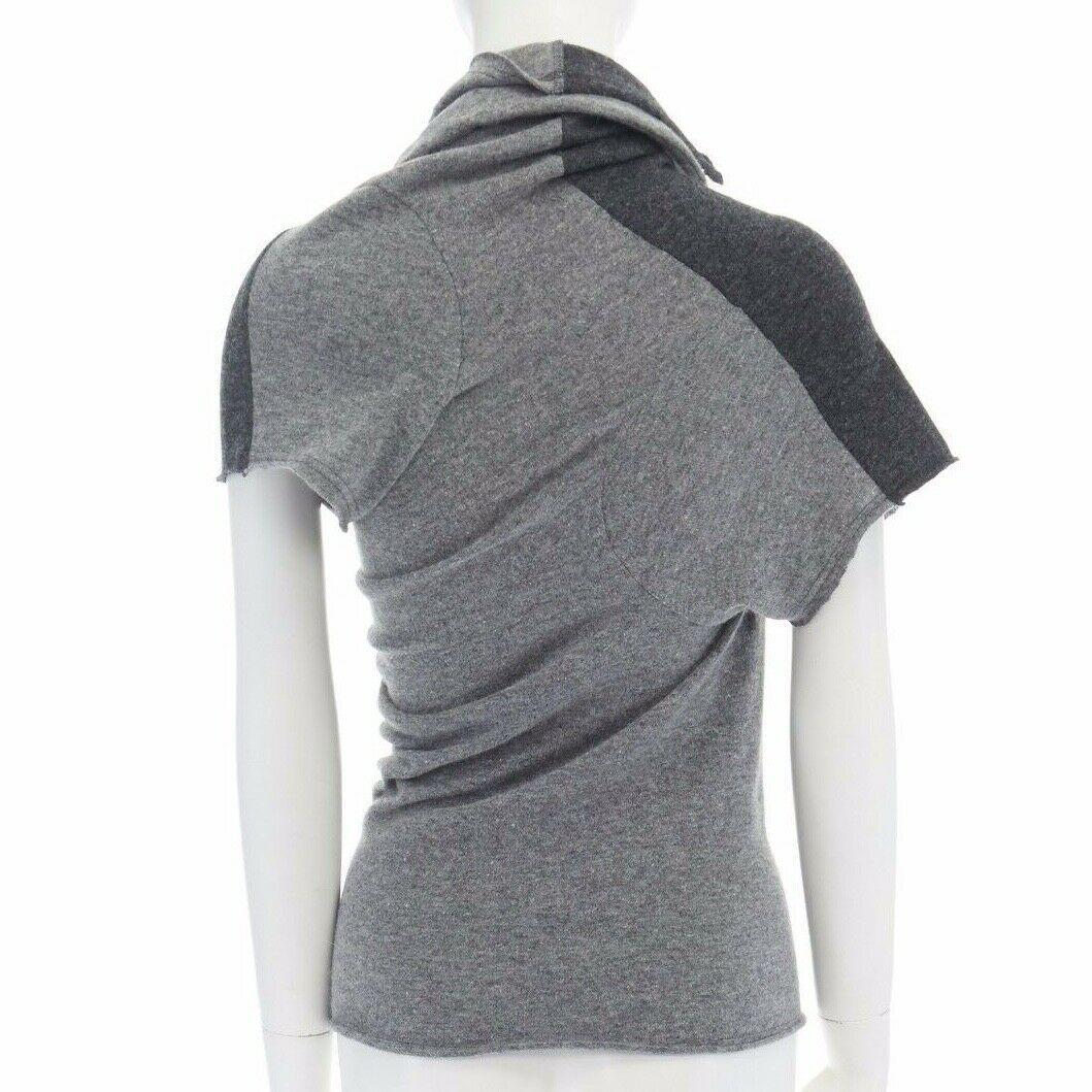 runway COMME DES GARCONS grey angora mix blend wrap draped neck colorblock top M

COMME DES GARCONS
FROM THE FALL WINTER 2002 COLLECTION
Wool, angora, nylon. Grey colorblocked. 
Wrap draped neck. Short sleeve top. 
Made in Japan.

CONDITION
Very