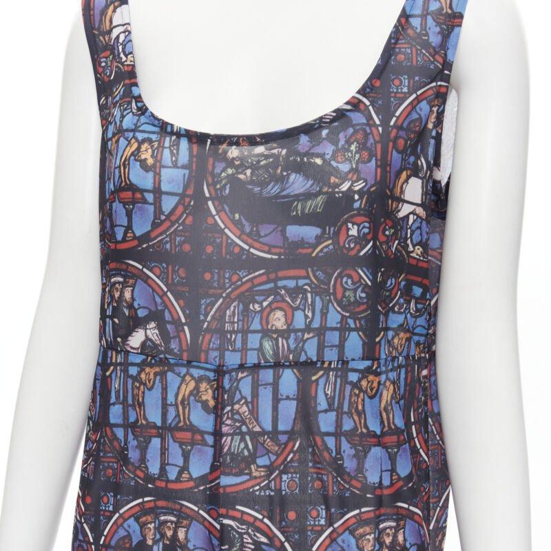 Runway COMME DES GARCONS Vintage 1990 Church Stained Glass print jumpsuit M
Reference: CRTI/A00553
Brand: Comme Des Garcons
Designer: Rei Kawakubo
Collection: 1990 - Runway
Material: Polyester
Color: Blue
Pattern: Multi
Extra Details: Straight leg