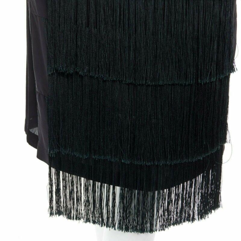 runway DRIES VAN NOTEN 2013 black fringe trim silk flapper dress FR38 US6 S
Reference: TGAS/A00412
Brand: Dries Van Noten
Collection: Fall Winter 2013 - Runway
Material: Silk
Color: Black
Pattern: Other
Extra Details: 
100% silk. Fringe front. Raw