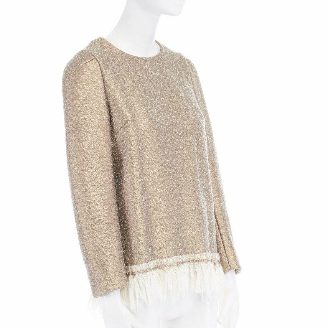 runway DRIES VAN NOTEN 2015 gold coated wool fringe hem sweater top FR36 XS 
Reference: CRTI/A00543 
Brand: Dries Van Noten 
Collection: Fall Winter 2015 Runway 
Material: Wool 
Color: Gold 
Pattern: Solid 
Closure: Zip Extra Detail: Clego sweater.