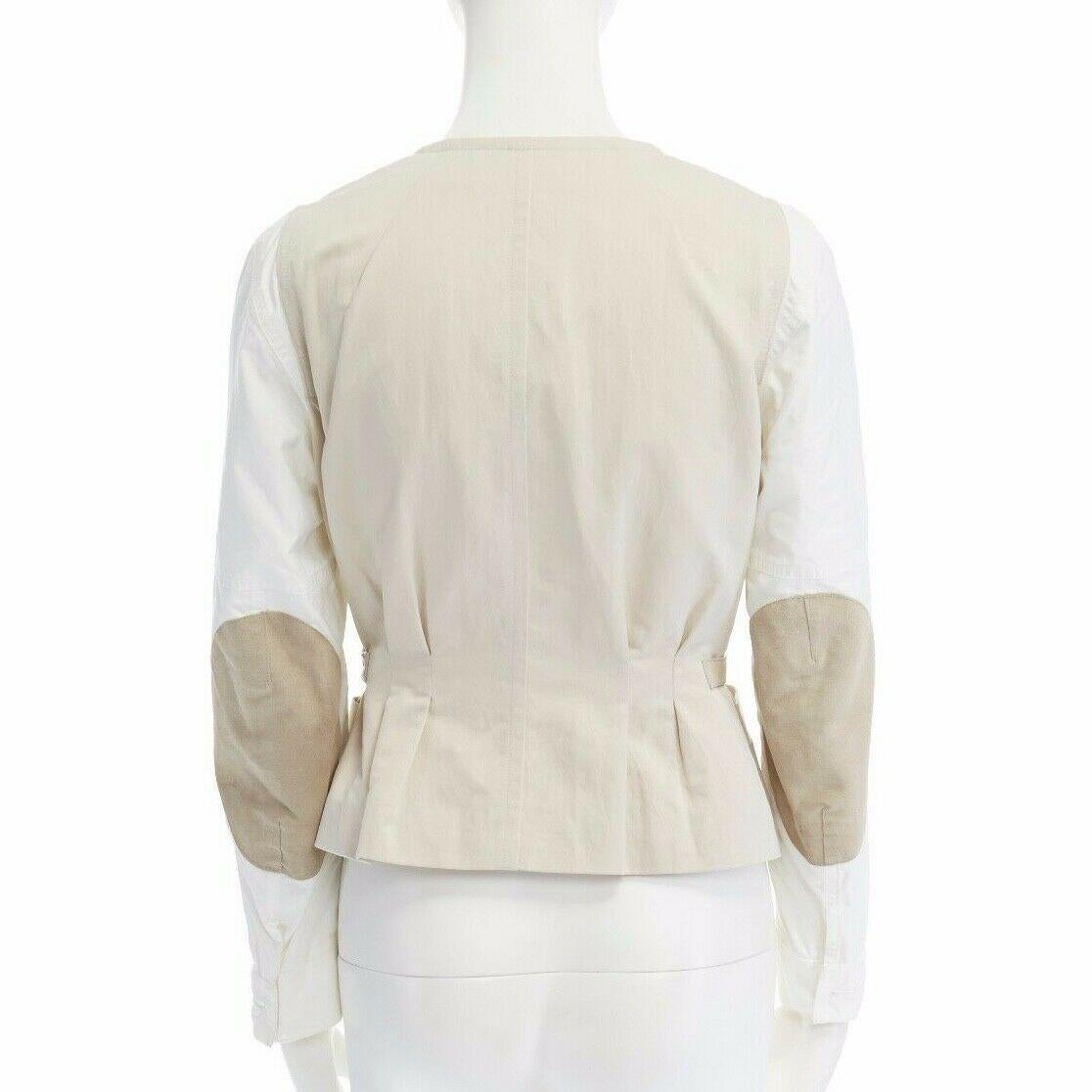 runway DRIES VAN NOTEN cream white contrast sleeve belted bomber jacket FR38 M
DRIES VAN NOTEN
FROM THE SPRING SUMMER 2011 RUNWAY
WHITE AND BEIGE . 
BEIGE BODY . 
COLLAR-LESS POPPER BUTTON FRONT CLOSURE .
 DUAL SLIT FRONT POCKET . 
CONTRASTING