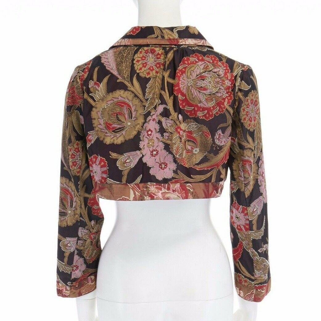 runway DRIES VAN NOTEN oriental floral jacquard raw cropped bolero jacket FR36 S
DRIES VAN NOTEN
Dark maroon silk base with gold and red oriental chinoiserie floral jacquard. 
Reversed raw fabric trimmed along neckline, hem and cuff. 
Spread collar.