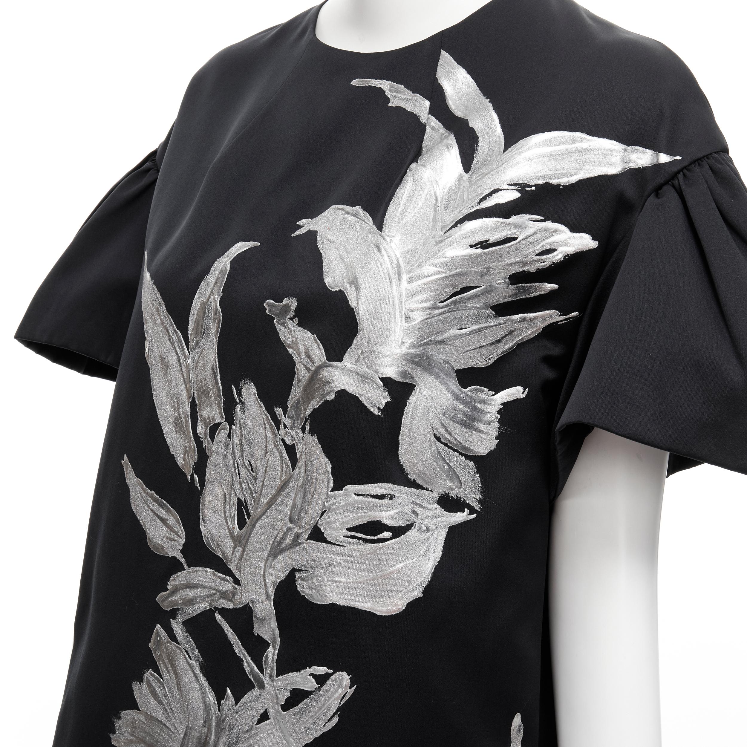 runway DRIES VAN NOTEN silver hand painted floral boxy sheath dress FR36 XS 
Reference: CELG/A00196 
Brand: Dries Van Noten 
Designer: Dries Van Noten 
Material: Polyester 
Color: Black 
Pattern: Floral 
Closure: Zip 
Extra Detail: Pleated flared